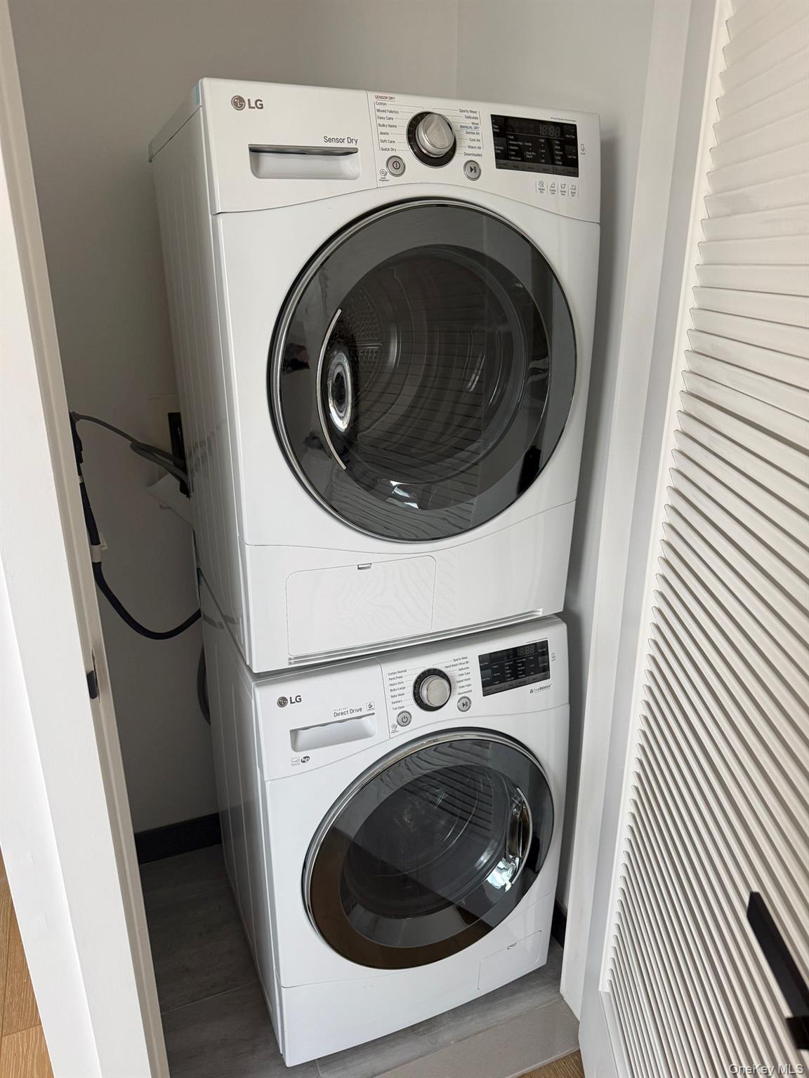 97-29 64th Road Queens, NY 11374 - Photo 7 of 12 a utility room with dryer and washer