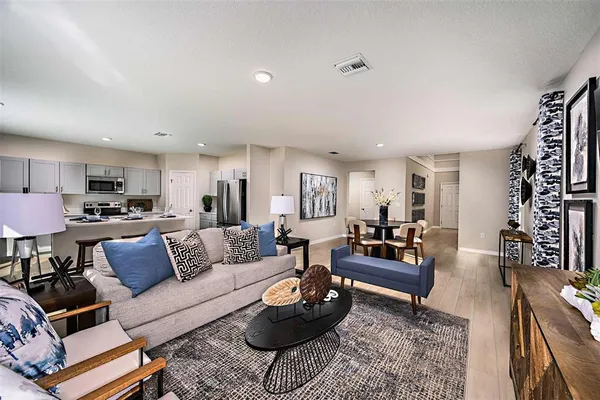 a living room with furniture and a rug