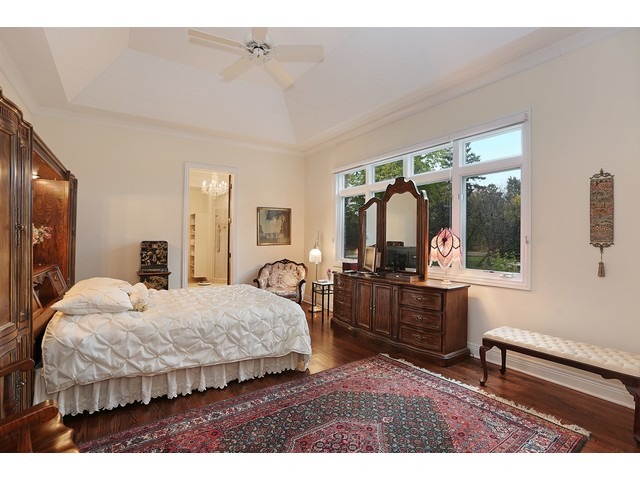 6350 Clarendon Hills Road Willowbrook, IL 60527 - Photo 11 of 25 a bedroom with a bed a large window and dresser