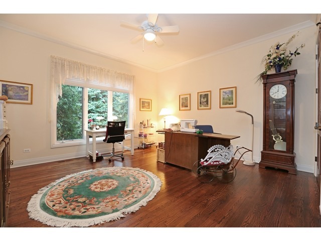 6350 Clarendon Hills Road Willowbrook, IL 60527 - Photo 16 of 25 a living room with furniture a fireplace and a table