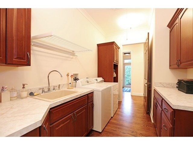 6350 Clarendon Hills Road Willowbrook, IL 60527 - Photo 20 of 25 a kitchen with a sink stove and cabinets
