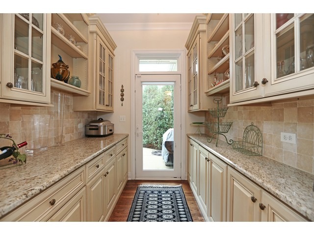 6350 Clarendon Hills Road Willowbrook, IL 60527 - Photo 7 of 25 a kitchen with a sink stove and cabinets