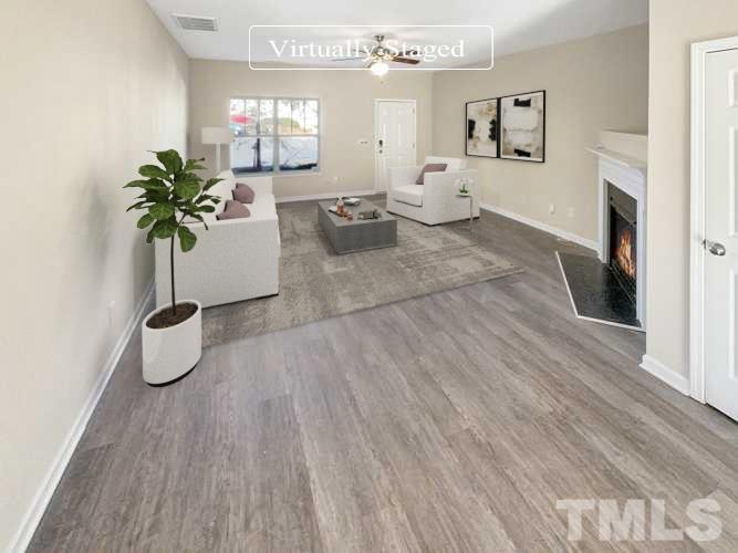 3501 Pinkham Way Raleigh, NC 27616 - Photo 20 of 20 a living room with furniture and a potted plant
