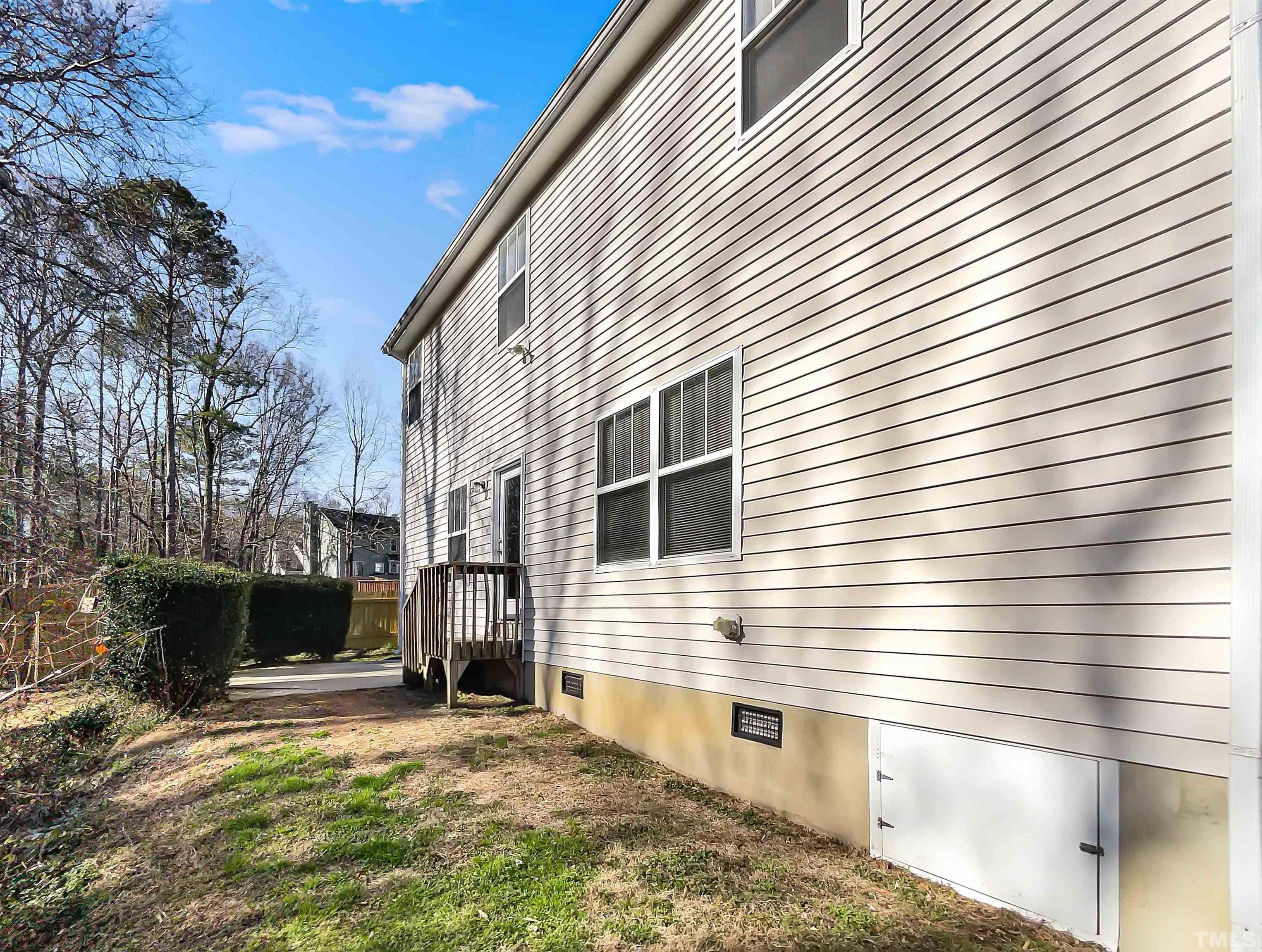 3501 Pinkham Way Raleigh, NC 27616 - Photo 5 of 20 a view of a house with a yard and a garage