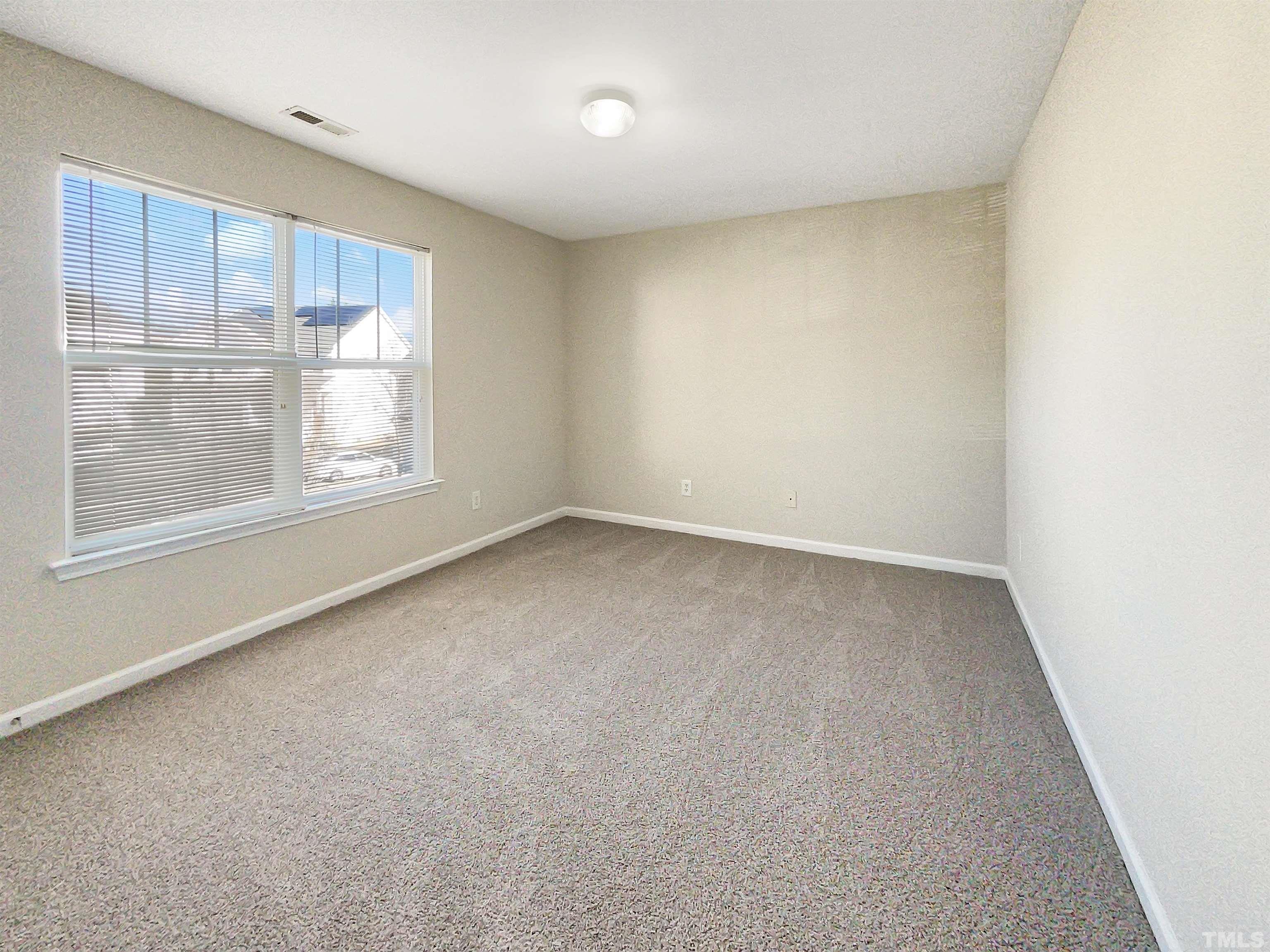 3501 Pinkham Way Raleigh, NC 27616 - Photo 10 of 20 an empty room with a window