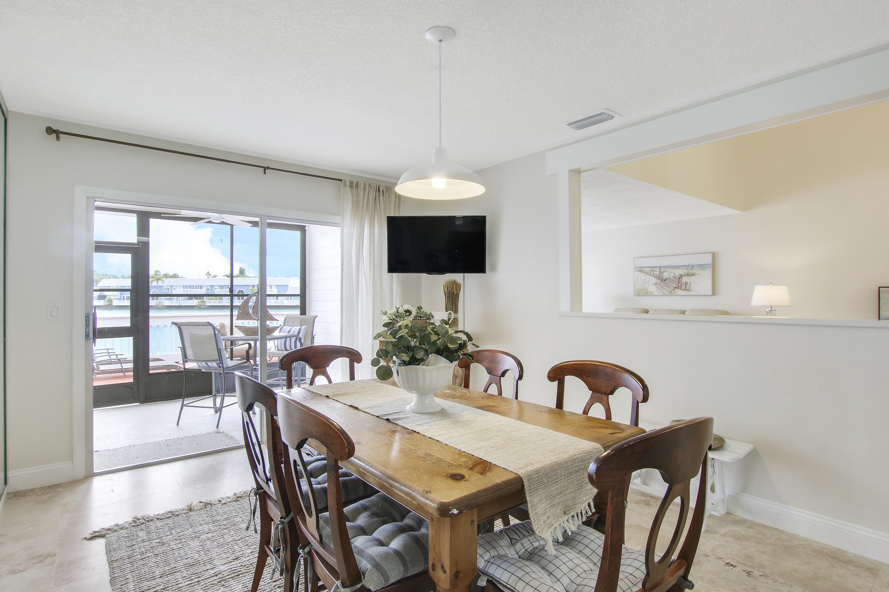 1219 Ocean Dunes Circle Jupiter, FL 33477 - Photo 17 of 23 Dining to Screened-In Patio