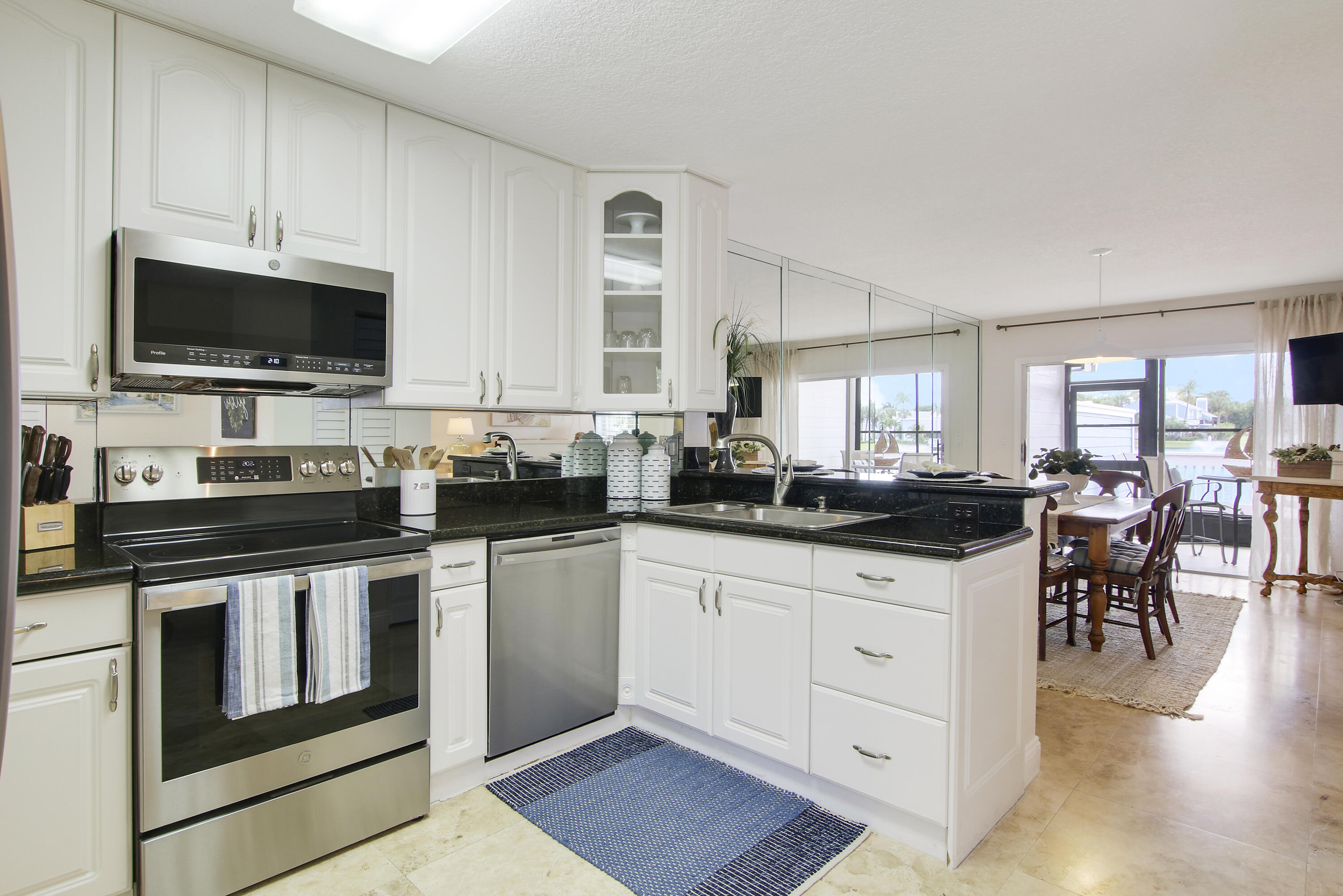 1219 Ocean Dunes Circle Jupiter, FL 33477 - Photo 19 of 23 Kitchen - Dining with Water Views