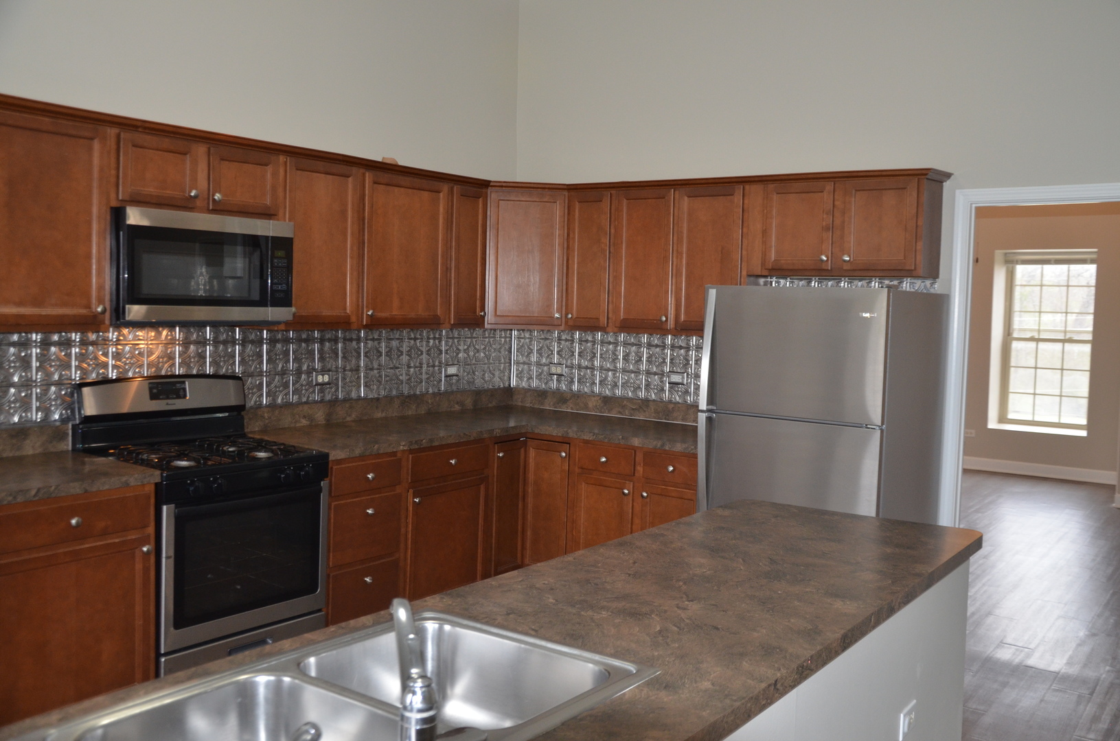 2026 North 3372nd Road, Unit 503 Ottawa, IL 61350 - Photo 25 of 49 a kitchen with a sink stove and refrigerator