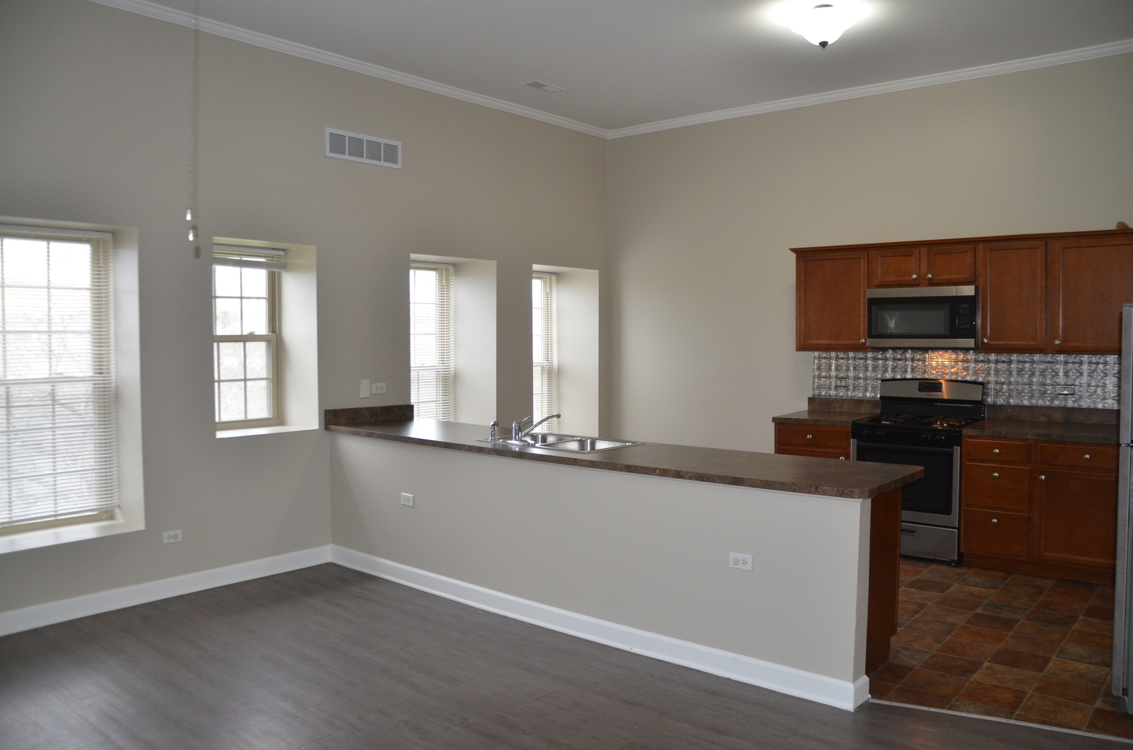 2026 North 3372nd Road, Unit 503 Ottawa, IL 61350 - Photo 26 of 49 a kitchen with stainless steel appliances granite countertop a stove and a sink