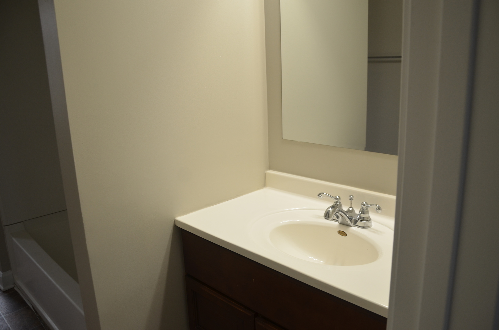 2026 North 3372nd Road, Unit 503 Ottawa, IL 61350 - Photo 36 of 49 a bathroom with a sink and a mirror