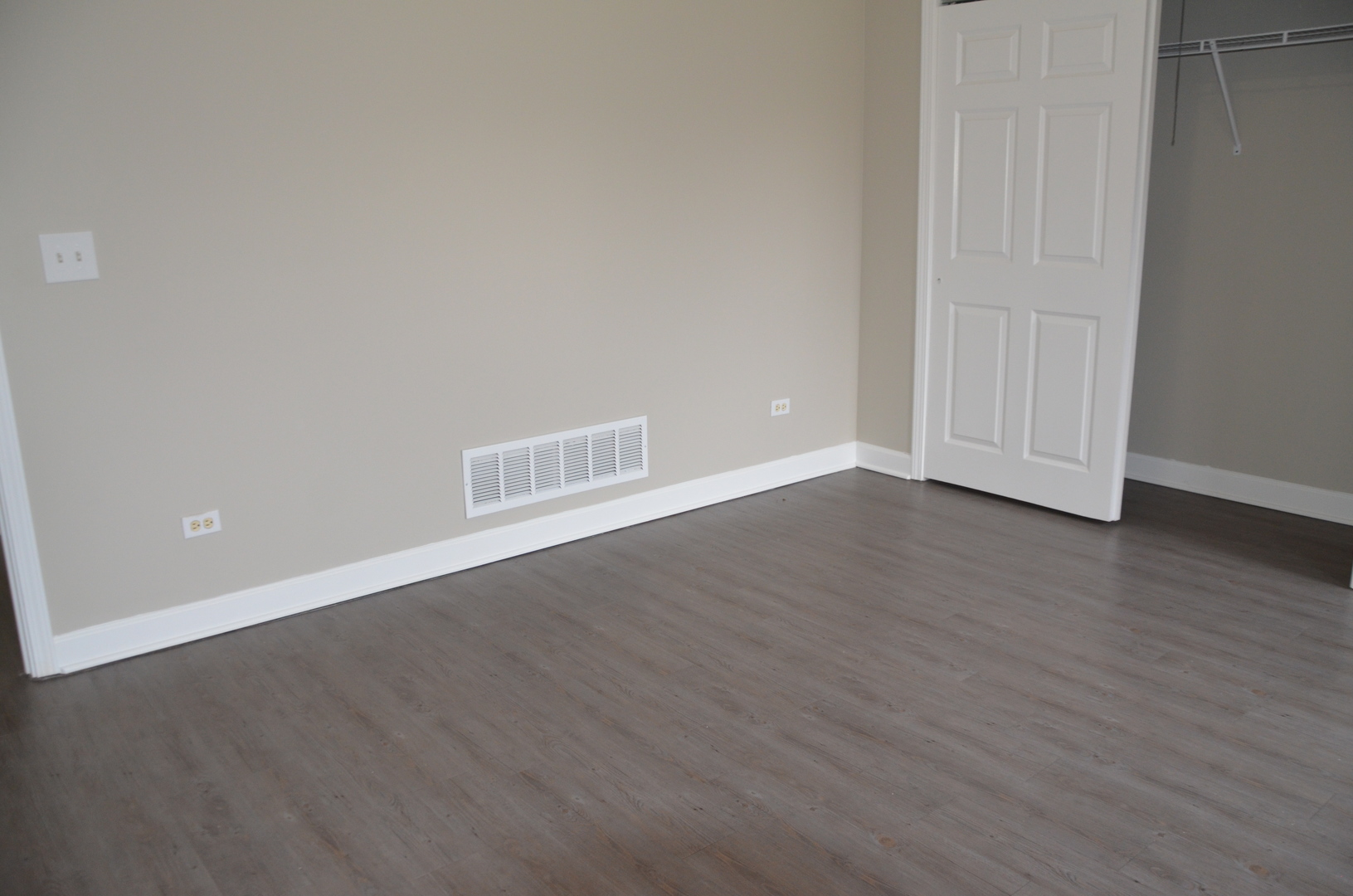 2026 North 3372nd Road, Unit 503 Ottawa, IL 61350 - Photo 44 of 49 an empty room with wooden floor and windows