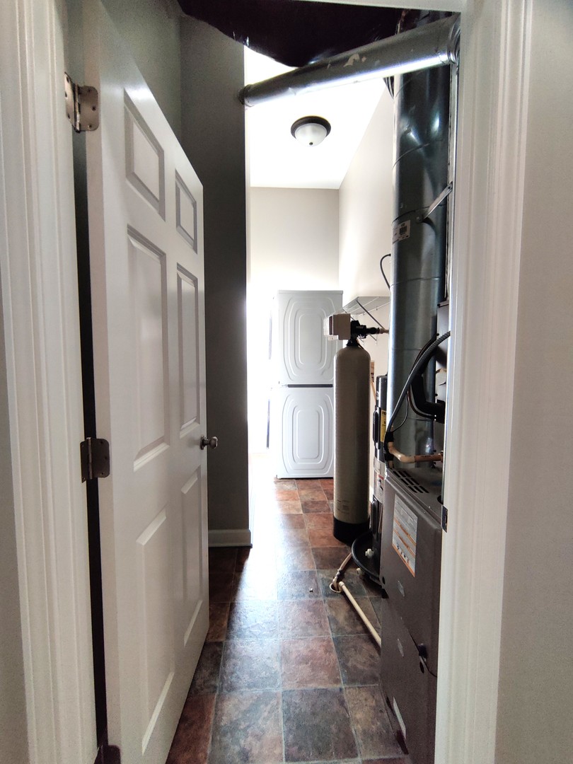 2026 North 3372nd Road, Unit 503 Ottawa, IL 61350 - Photo 8 of 49 a view of a hallway with closet and a fireplace