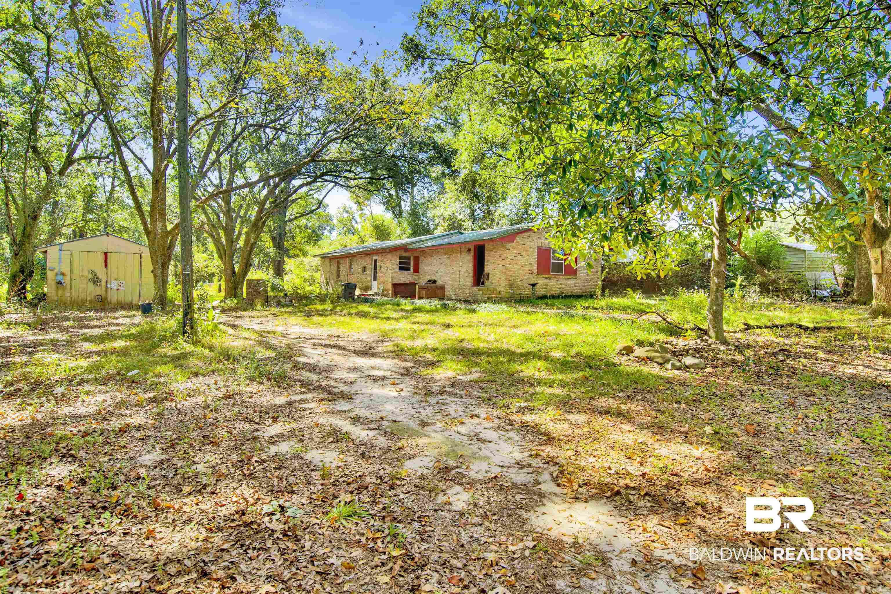 7623 Old Shell Road Mobile, AL 36608 - Photo 1 of 12 View of yard featuring an outbuilding