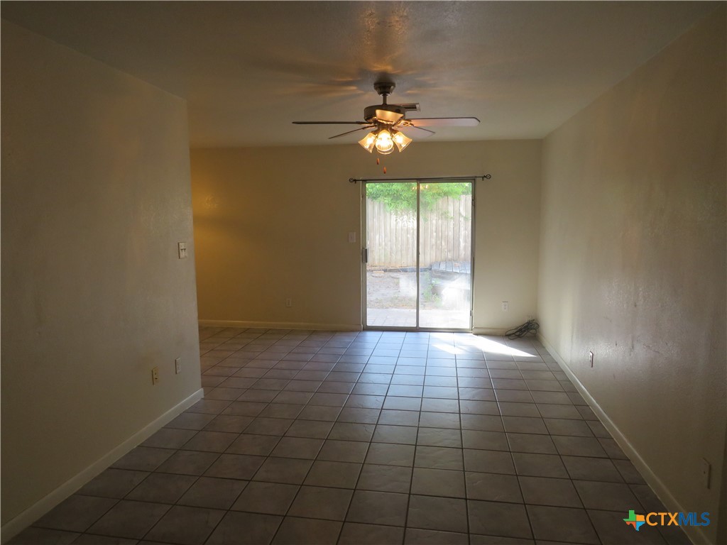 8221 Sam Rayburn Drive, Unit 103 Austin, TX 78753 - Photo 2 of 15 a view of an empty room with a chandelier fan