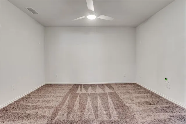 a bathroom with a shower sink and mirror