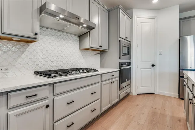 a bathroom with a sink a mirror and a window