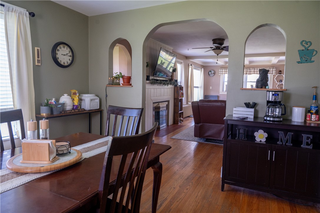 3365 Trapping Brook Road Wellsville, NY 14895 - Photo 10 of 47 The arched openings give a lot of charm and airy feeling all at the same time. The original hardwood floors flow between the living and dining rooms and give great aesthetic continuity.