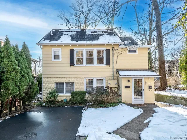 front view of a house with a yard