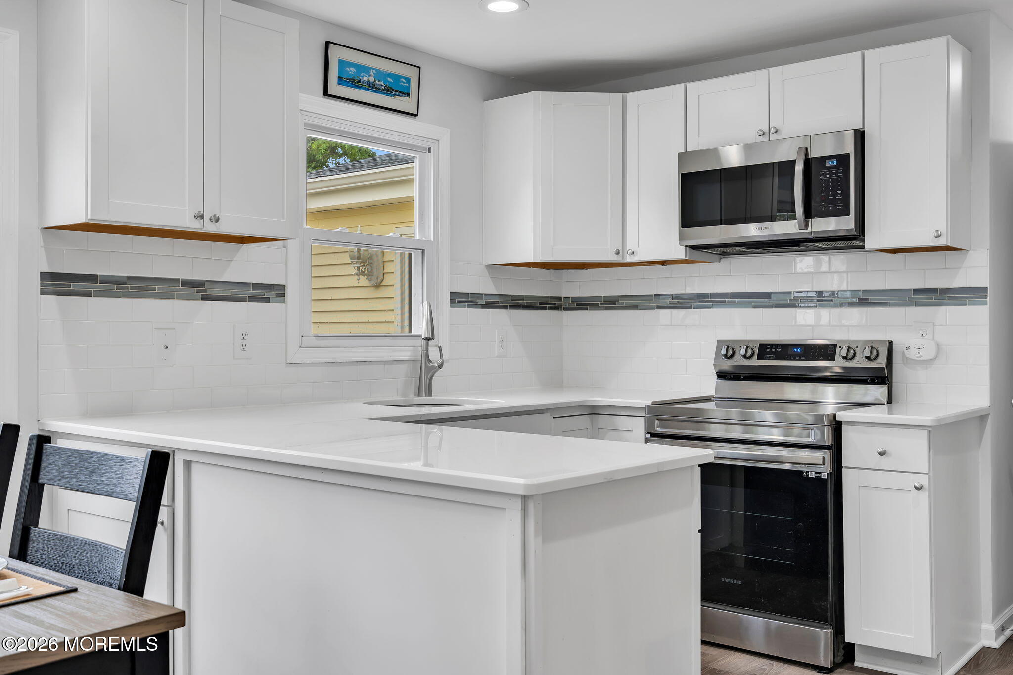 96 Yellowbank Road Toms River, NJ 08753 - Photo 3 of 45 a kitchen with stainless steel appliances a stove microwave and sink