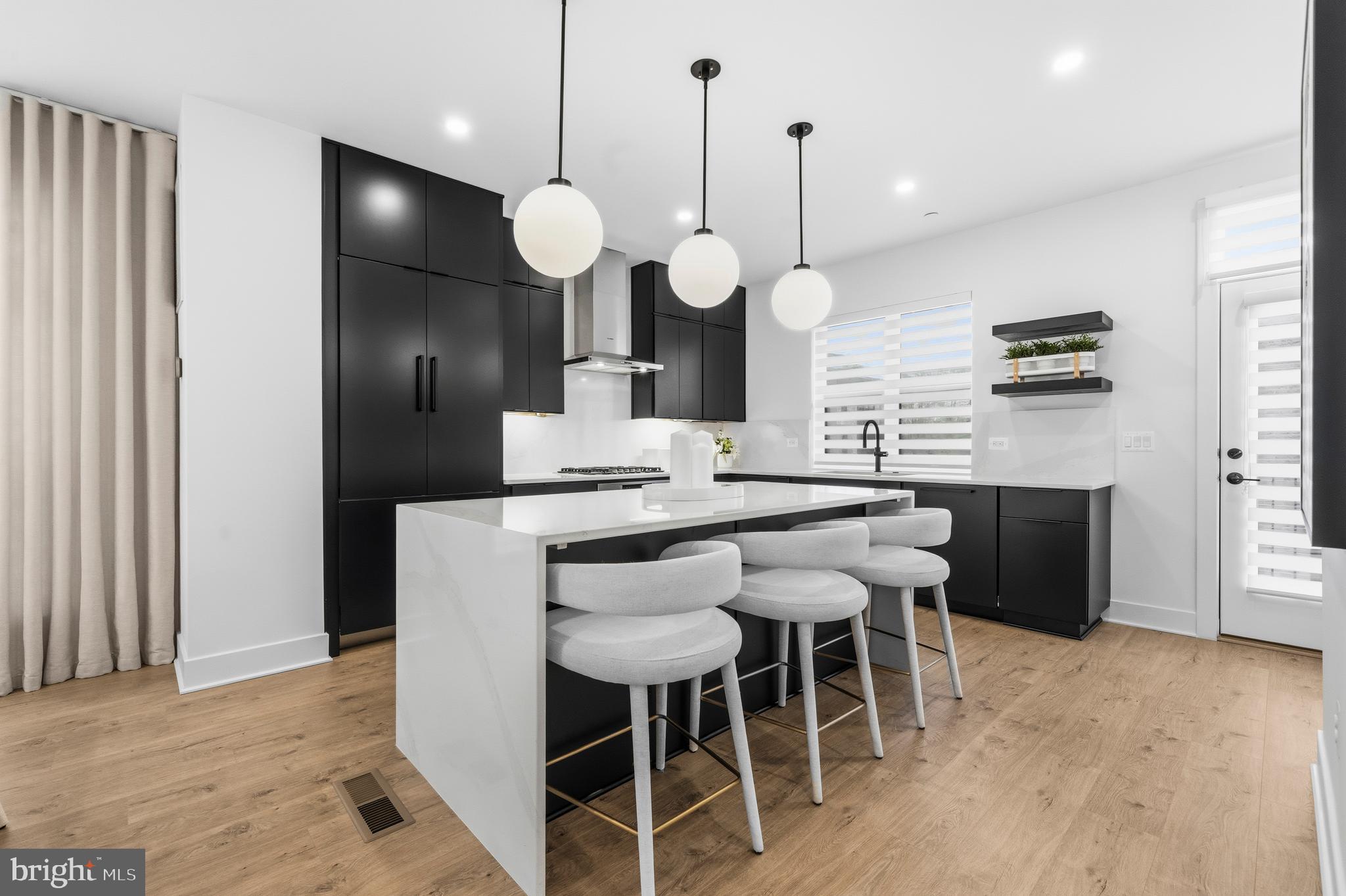 2040 Tysons Ridgeline Road Falls Church, VA 22043 - Photo 12 of 56 a kitchen with a table and chairs in it