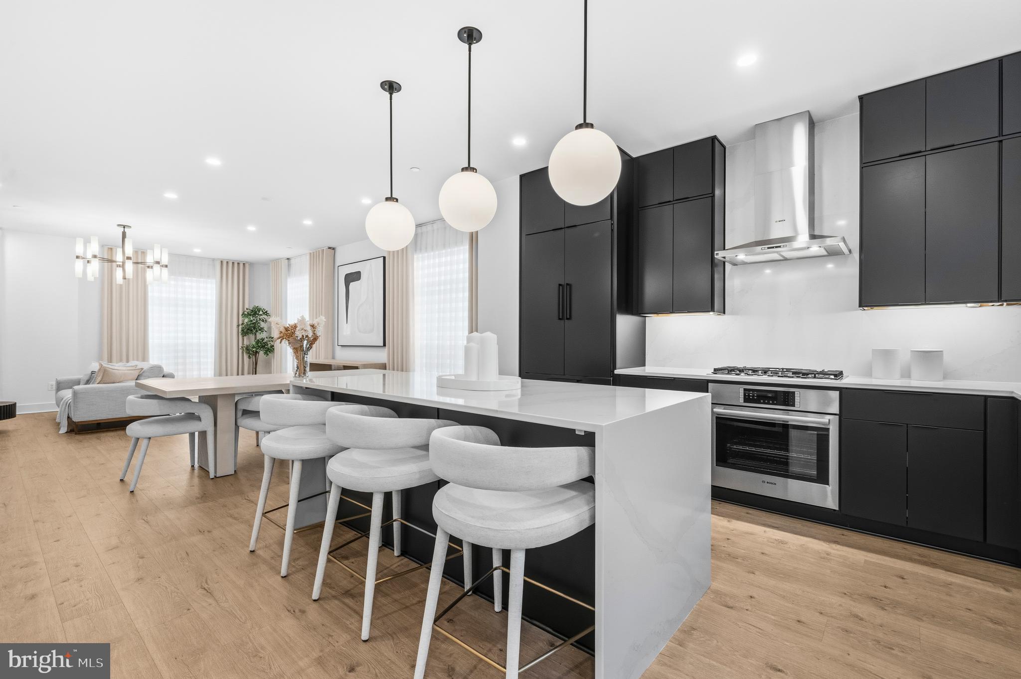 2040 Tysons Ridgeline Road Falls Church, VA 22043 - Photo 13 of 56 a kitchen with a dining table chairs sink and stove