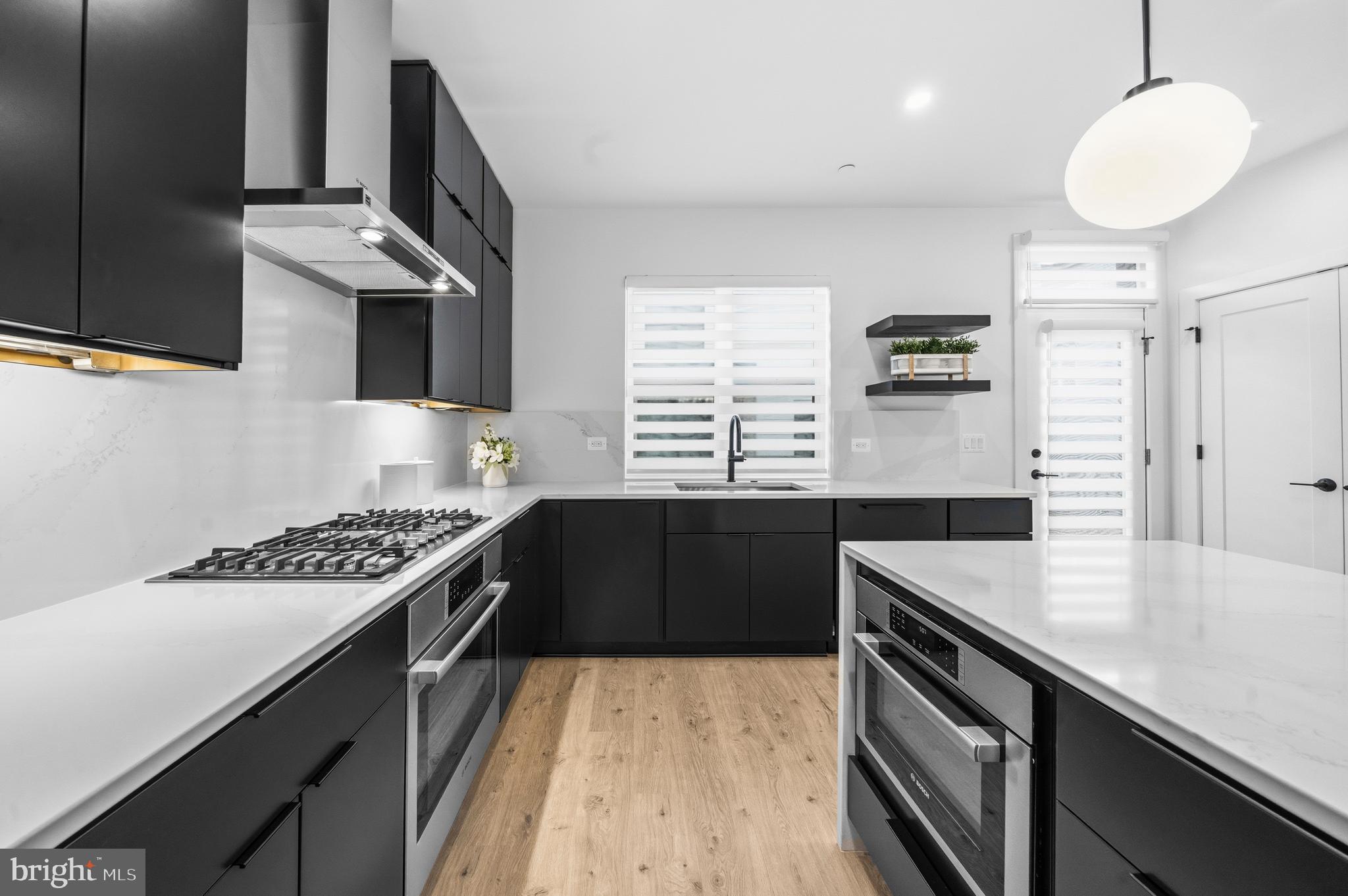 2040 Tysons Ridgeline Road Falls Church, VA 22043 - Photo 16 of 56 a kitchen with stainless steel appliances granite countertop a sink stove and refrigerator