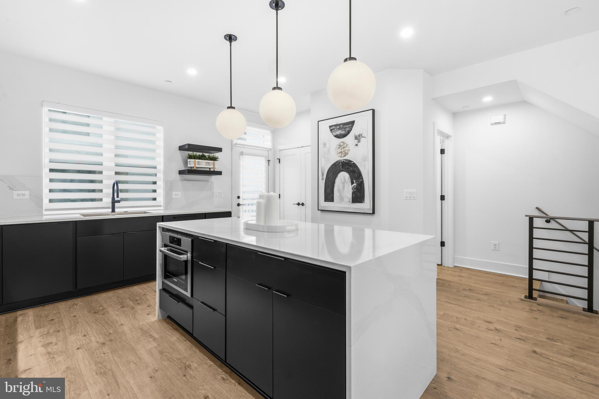 2040 Tysons Ridgeline Road Falls Church, VA 22043 - Photo 17 of 56 a kitchen with a sink a counter space and a window