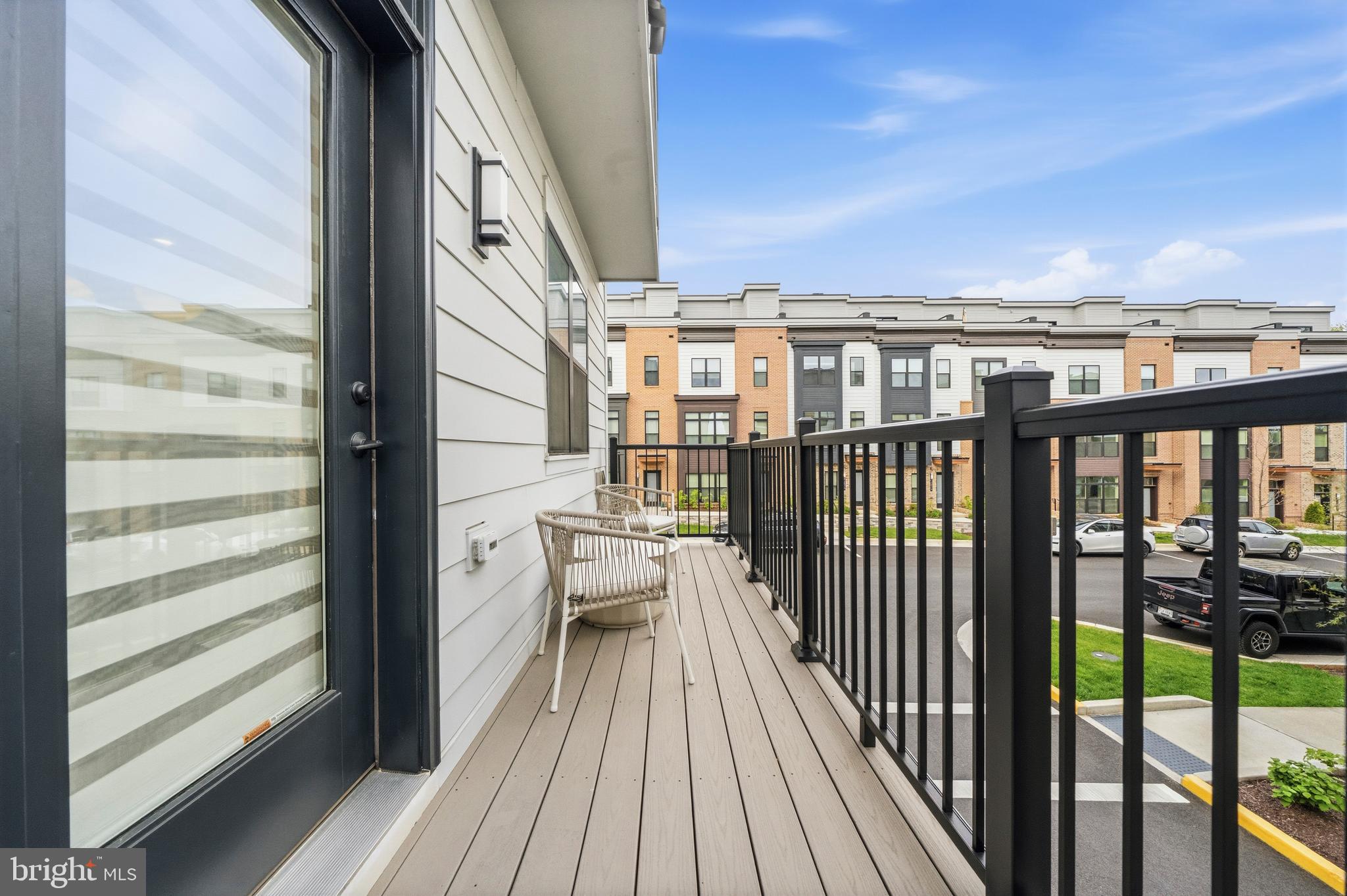 2040 Tysons Ridgeline Road Falls Church, VA 22043 - Photo 20 of 56 a view of a balcony with wooden floor and fence