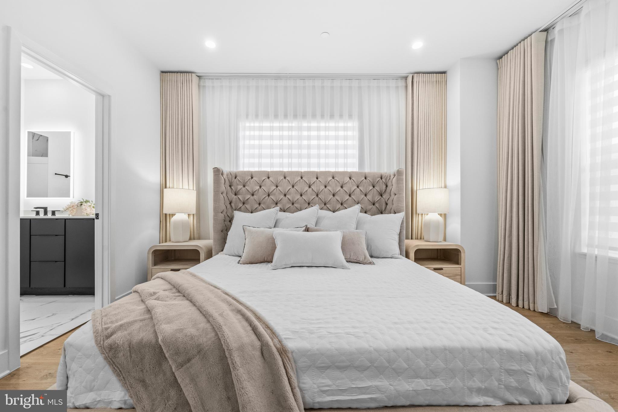 2040 Tysons Ridgeline Road Falls Church, VA 22043 - Photo 22 of 56 a bedroom with a large bed and a window