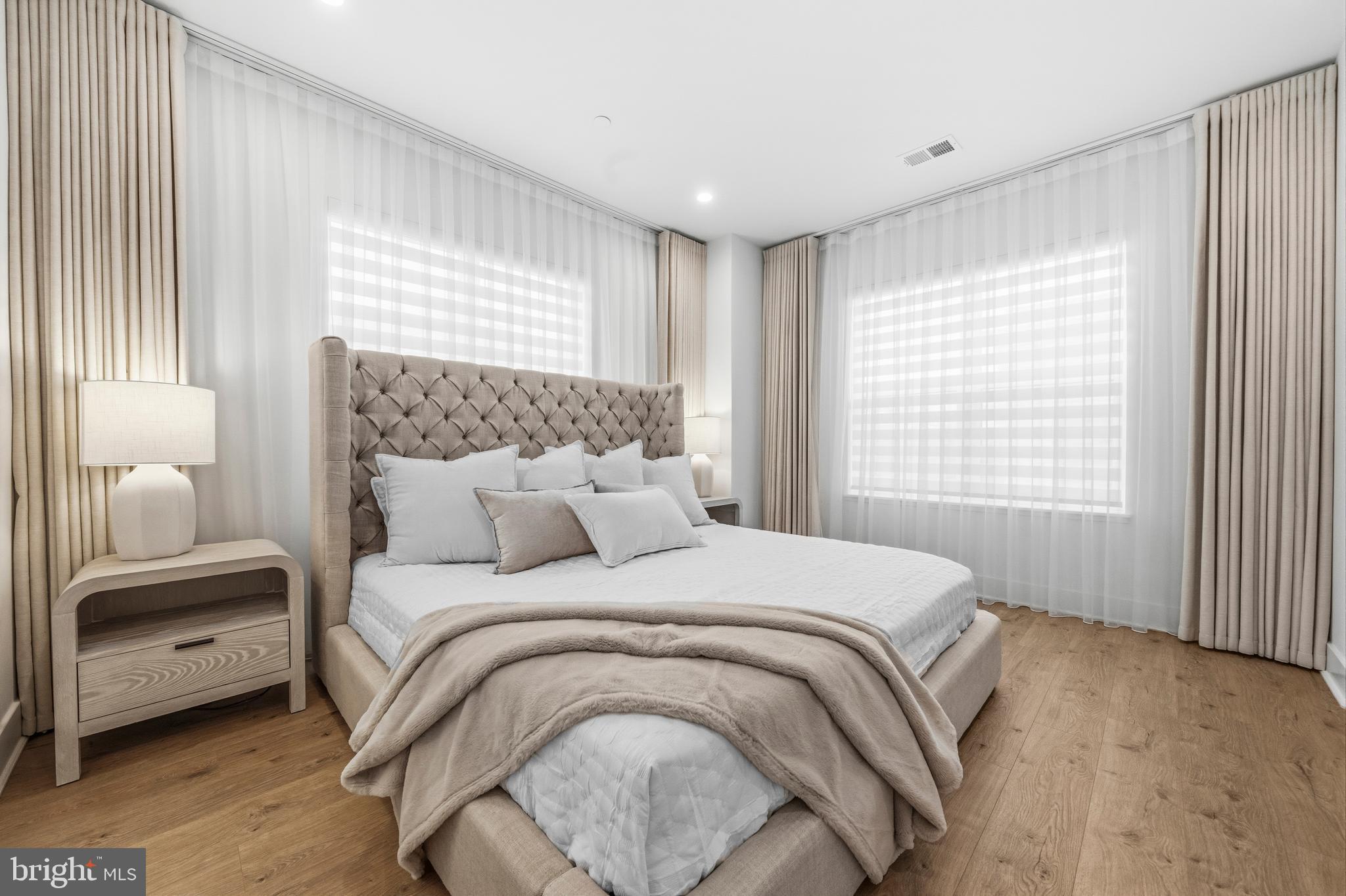 2040 Tysons Ridgeline Road Falls Church, VA 22043 - Photo 23 of 56 a bedroom with a bed and a large window