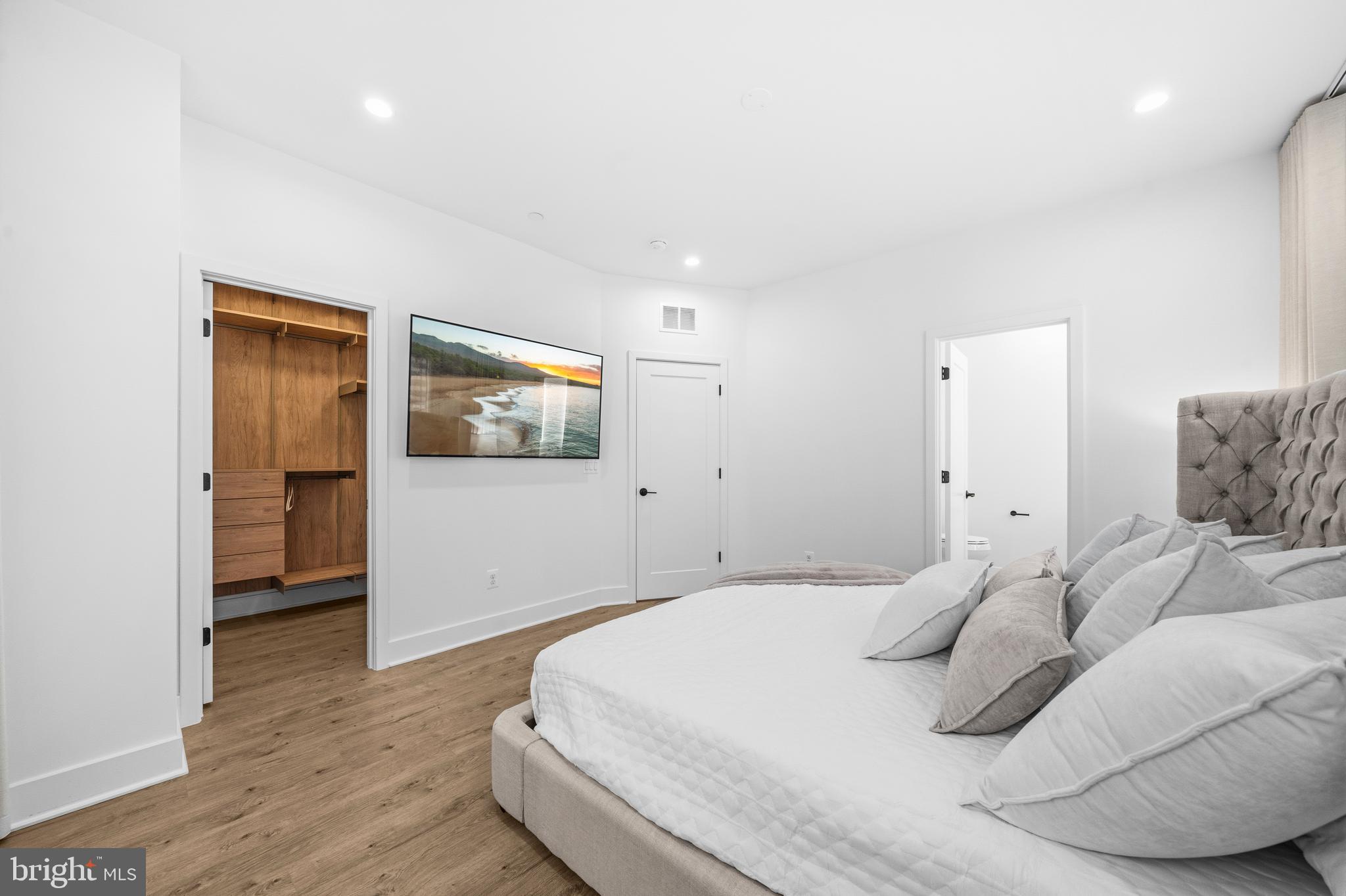 2040 Tysons Ridgeline Road Falls Church, VA 22043 - Photo 24 of 56 a bedroom with a bed and a couch