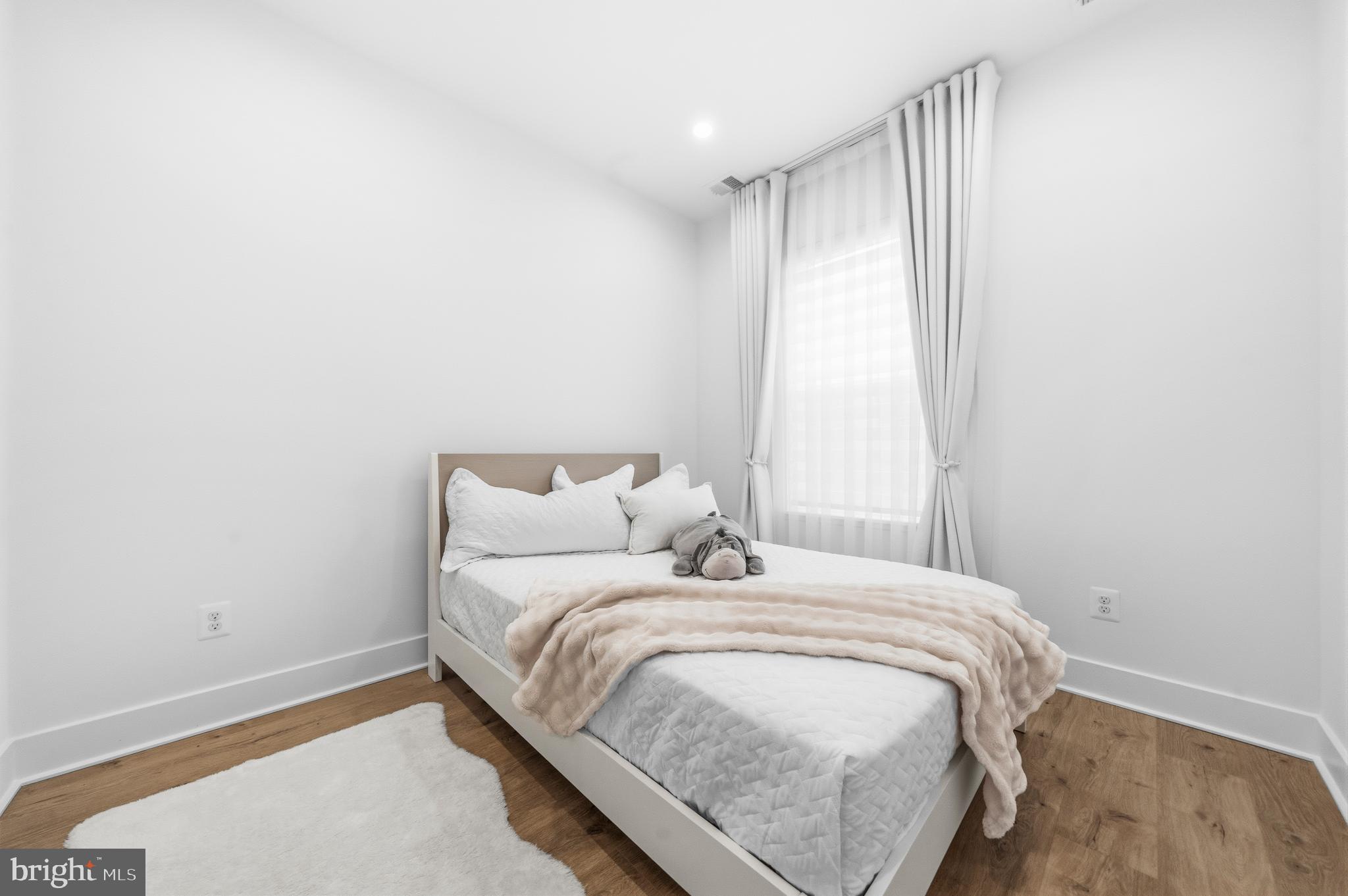 2040 Tysons Ridgeline Road Falls Church, VA 22043 - Photo 30 of 56 a bedroom with a bed and a window