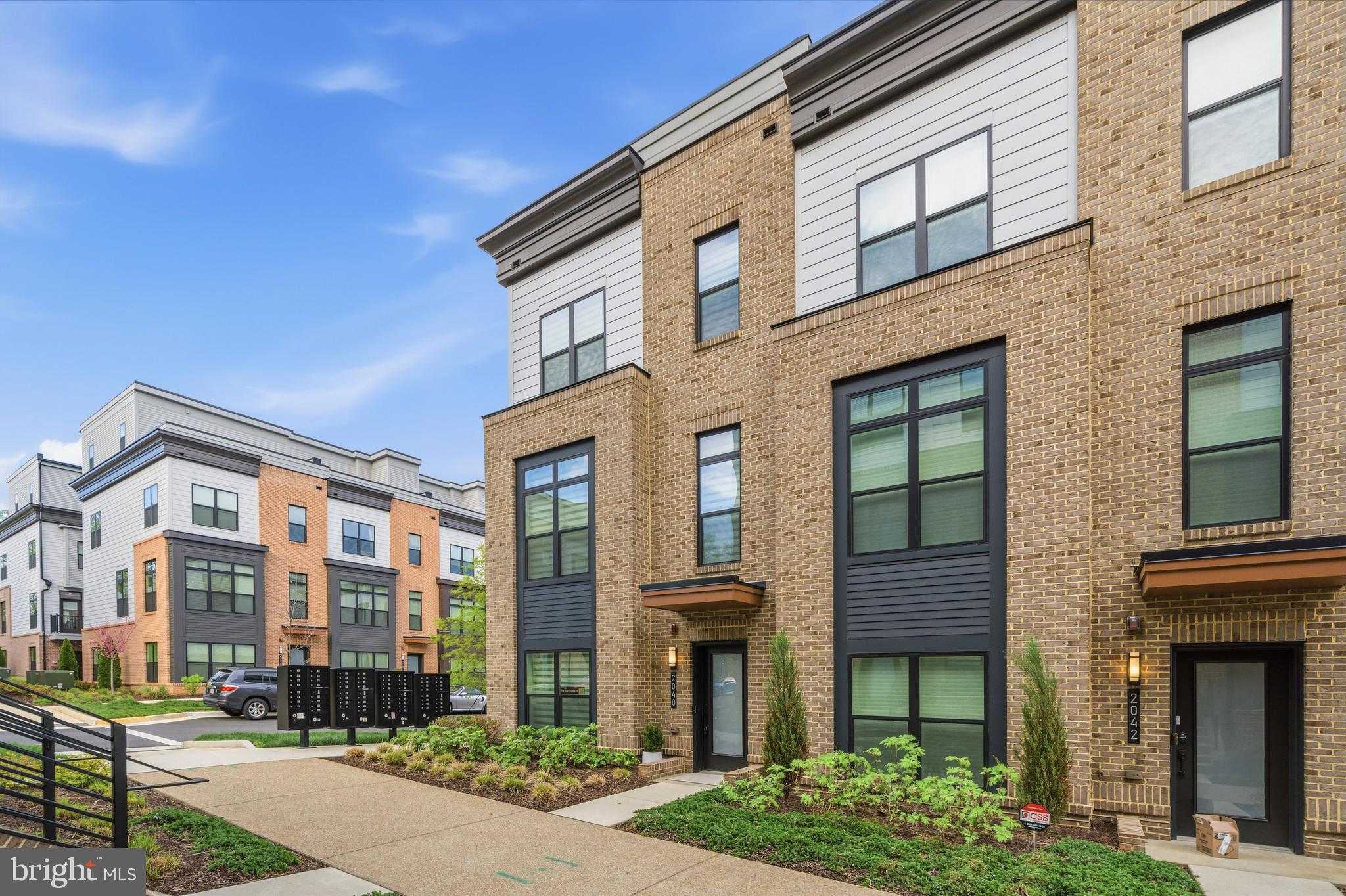 2040 Tysons Ridgeline Road Falls Church, VA 22043 - Photo 3 of 56 a front view of a building with a garden