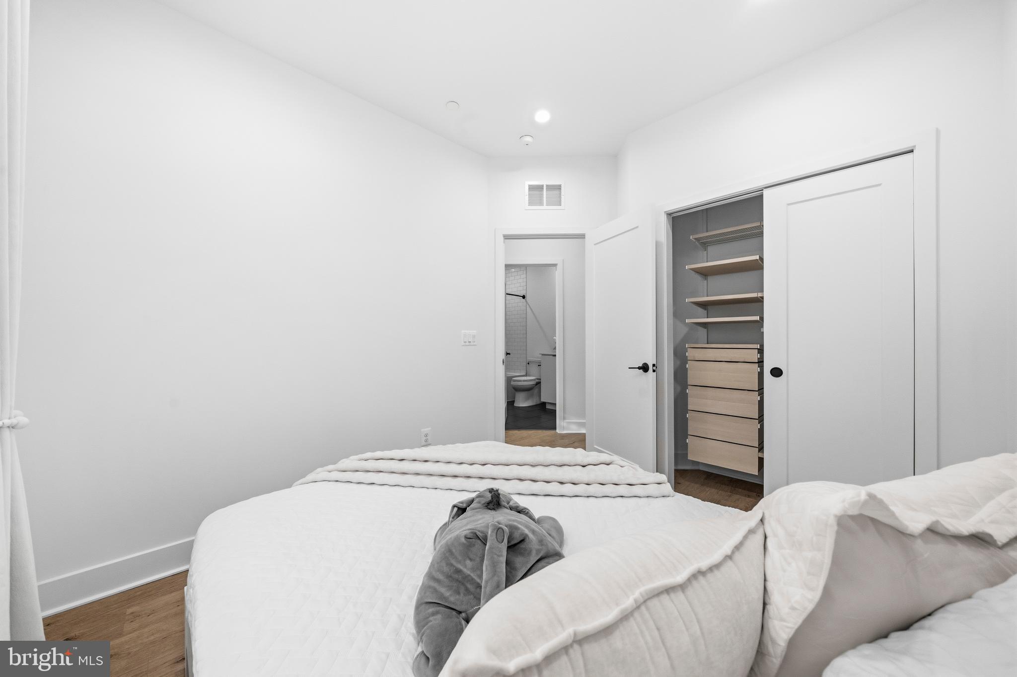 2040 Tysons Ridgeline Road Falls Church, VA 22043 - Photo 31 of 56 a bedroom with a bed and a cabinets