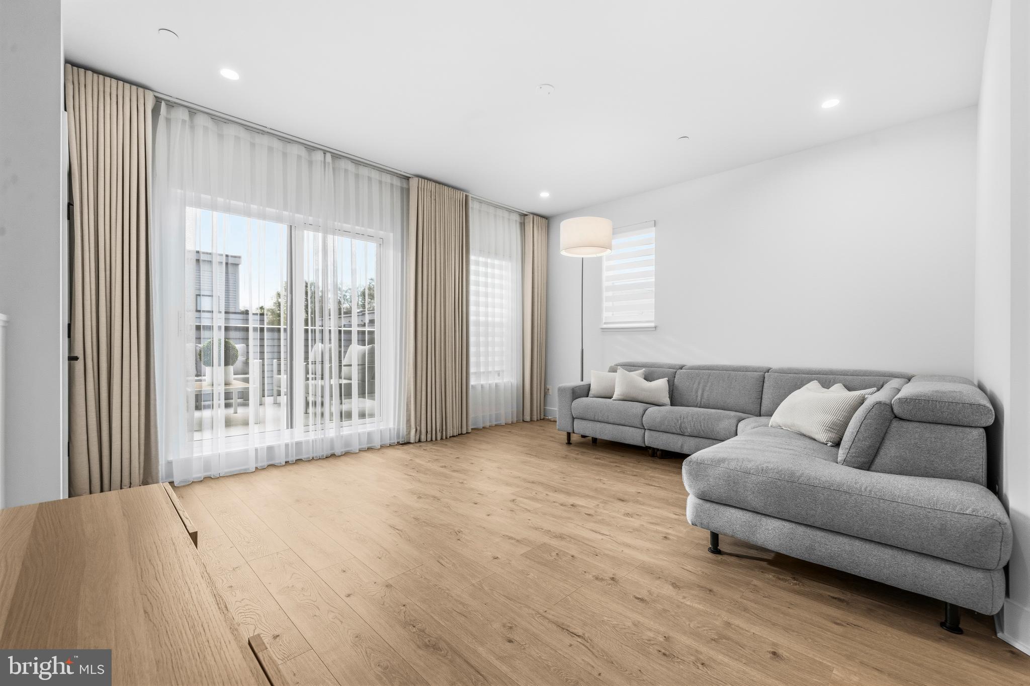 2040 Tysons Ridgeline Road Falls Church, VA 22043 - Photo 33 of 56 a living room with furniture and a large window
