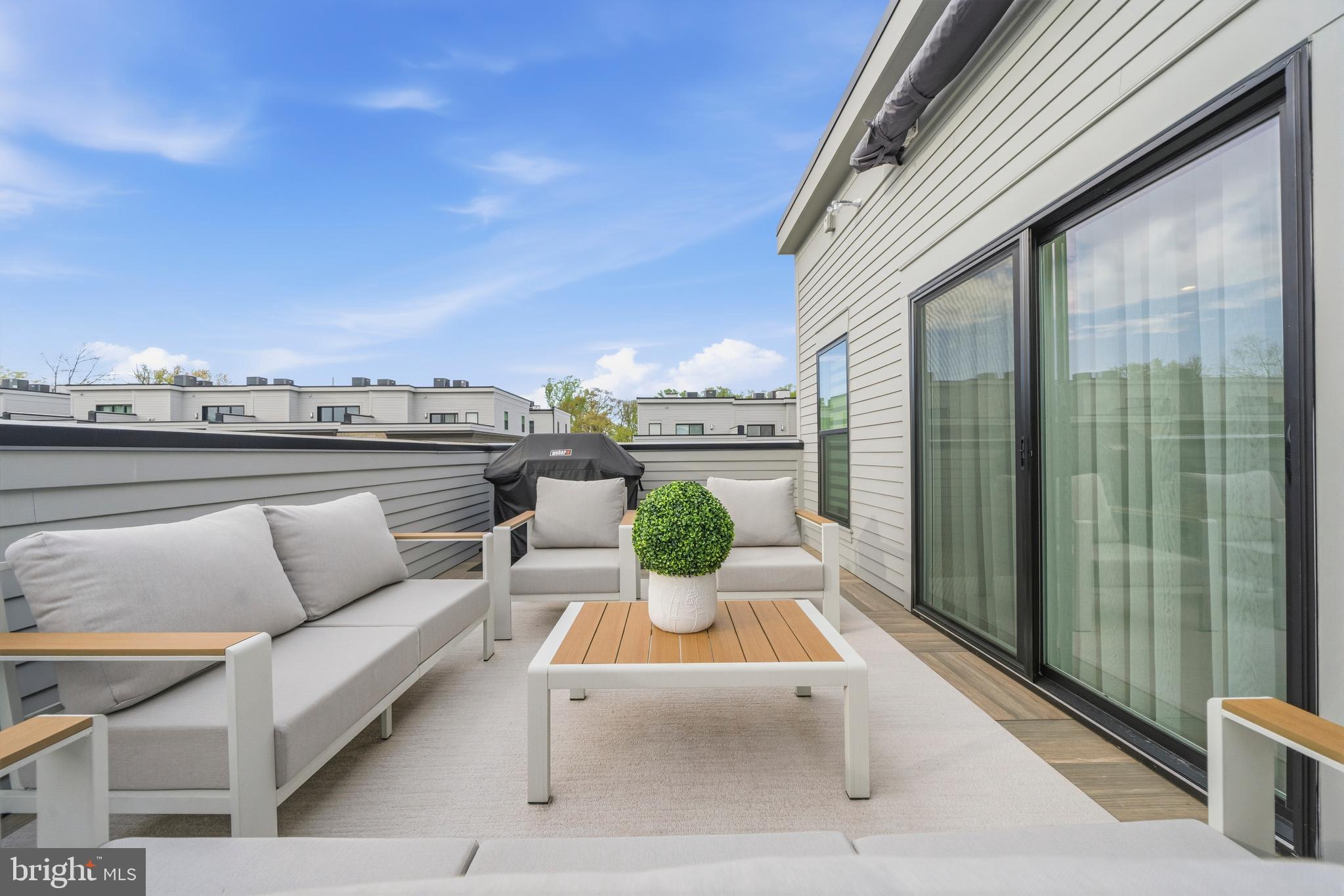 2040 Tysons Ridgeline Road Falls Church, VA 22043 - Photo 34 of 56 a view of roof deck with seating space and a potted plants