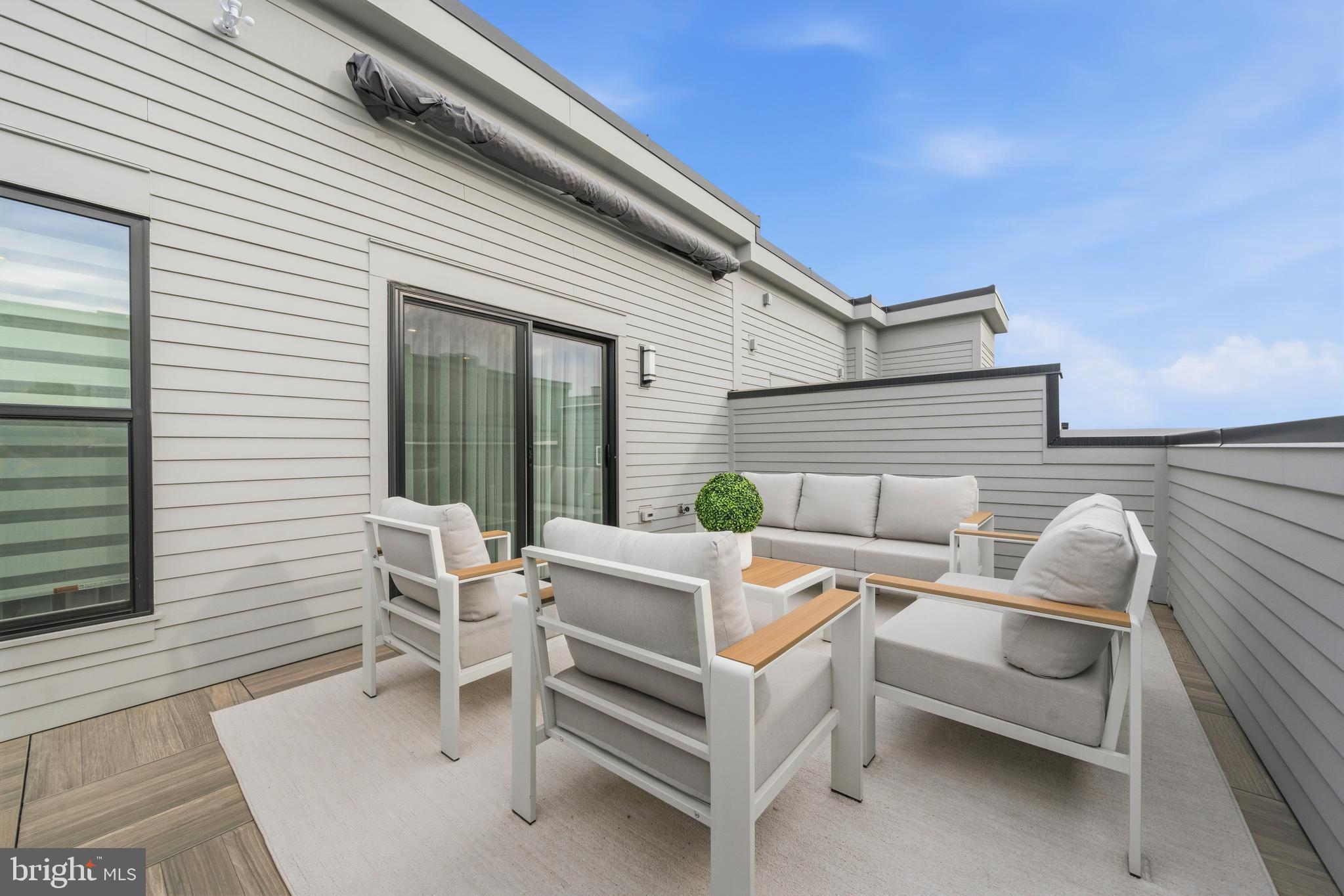 2040 Tysons Ridgeline Road Falls Church, VA 22043 - Photo 35 of 56 a view of a patio with a table and chairs and couches