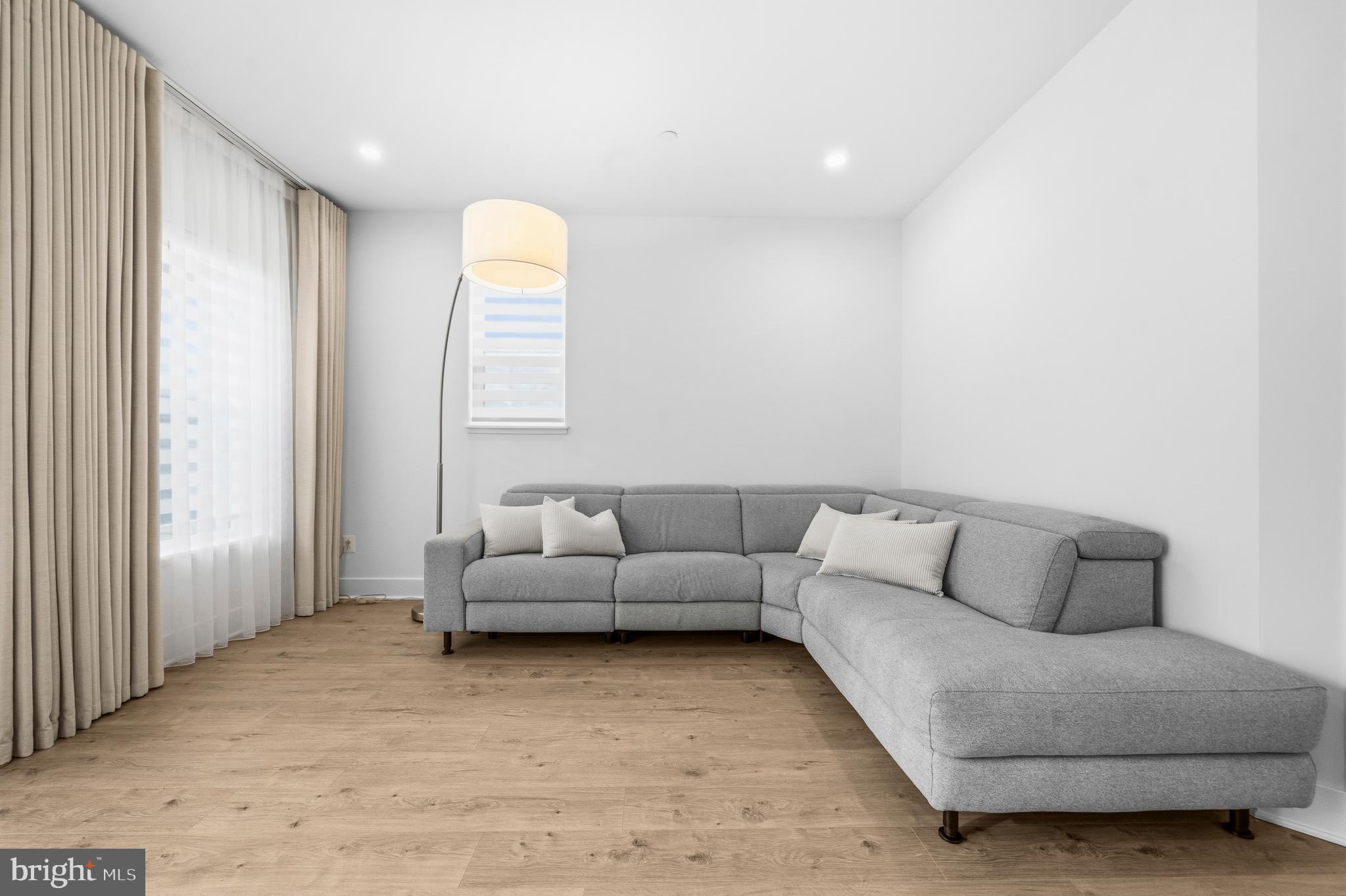 2040 Tysons Ridgeline Road Falls Church, VA 22043 - Photo 36 of 56 a living room with furniture and a large window