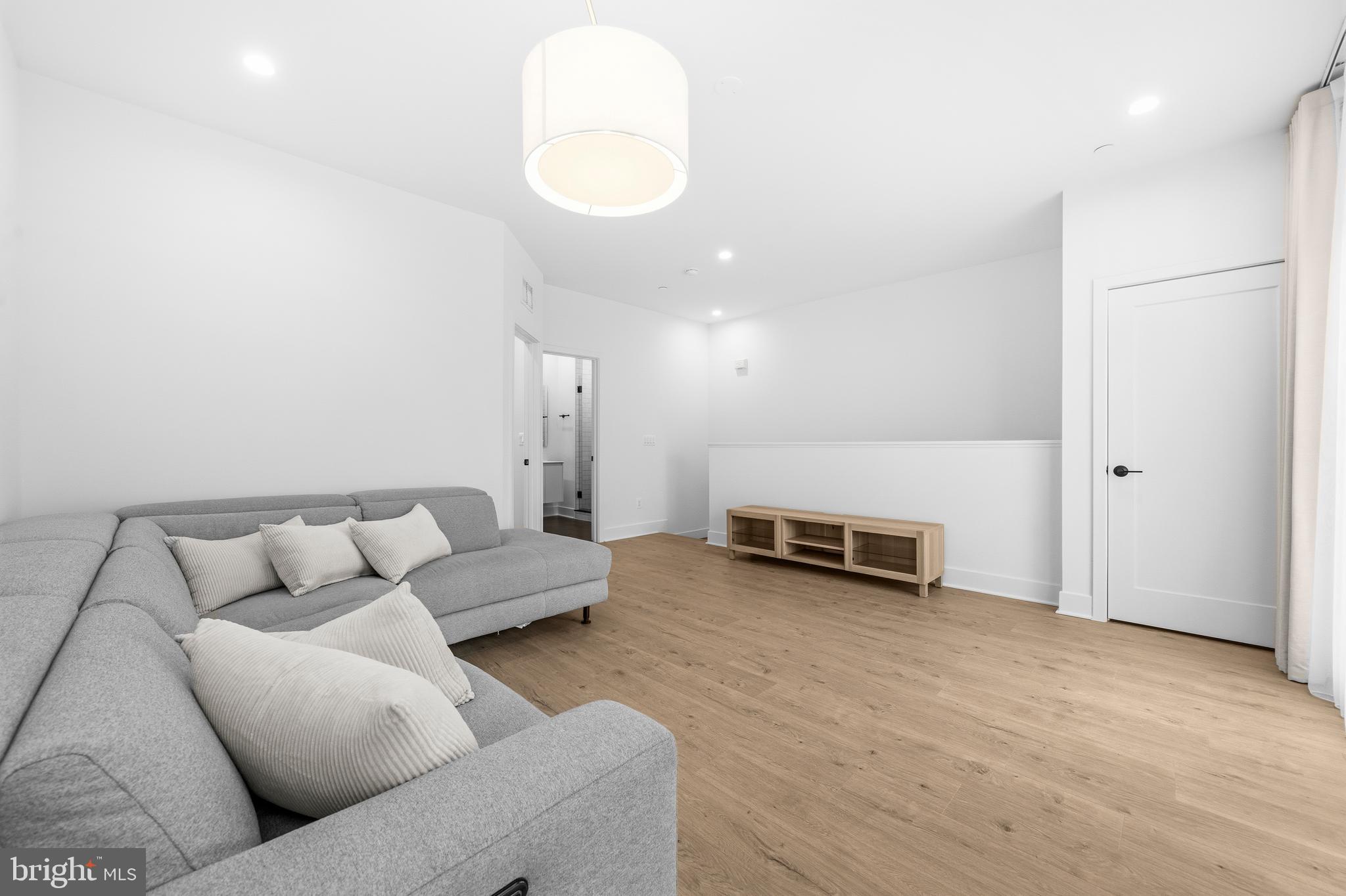 2040 Tysons Ridgeline Road Falls Church, VA 22043 - Photo 37 of 56 a living room with furniture and a couch