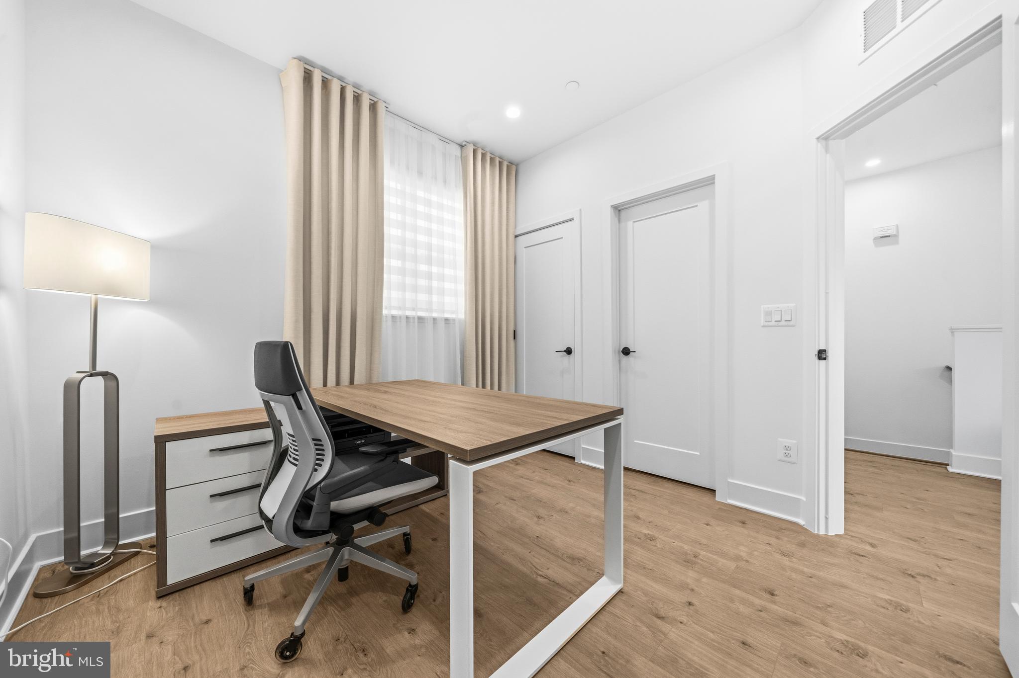 2040 Tysons Ridgeline Road Falls Church, VA 22043 - Photo 40 of 56 a view of a workspace with furniture and a window