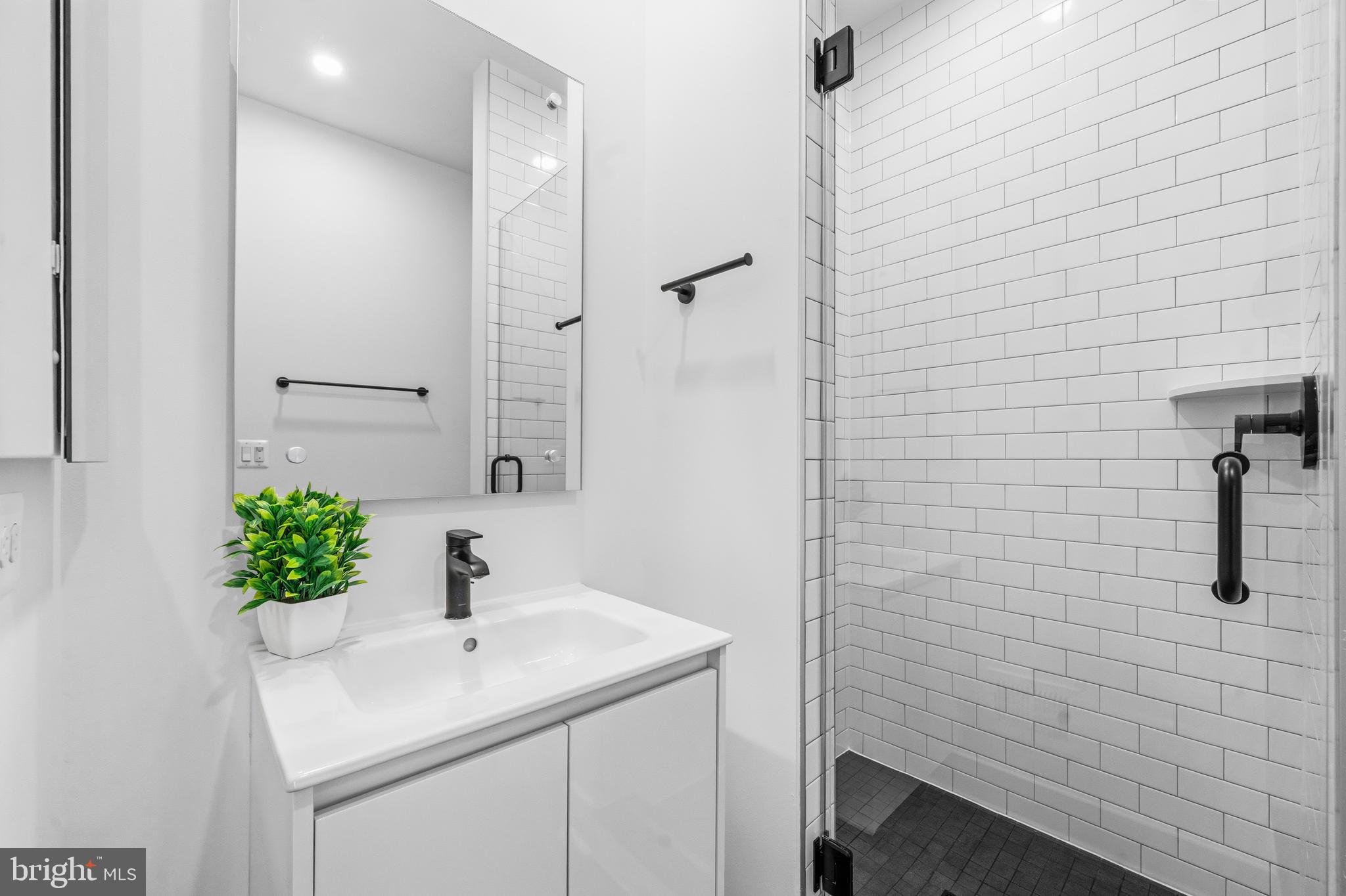 2040 Tysons Ridgeline Road Falls Church, VA 22043 - Photo 41 of 56 a bathroom with a sink and a mirror