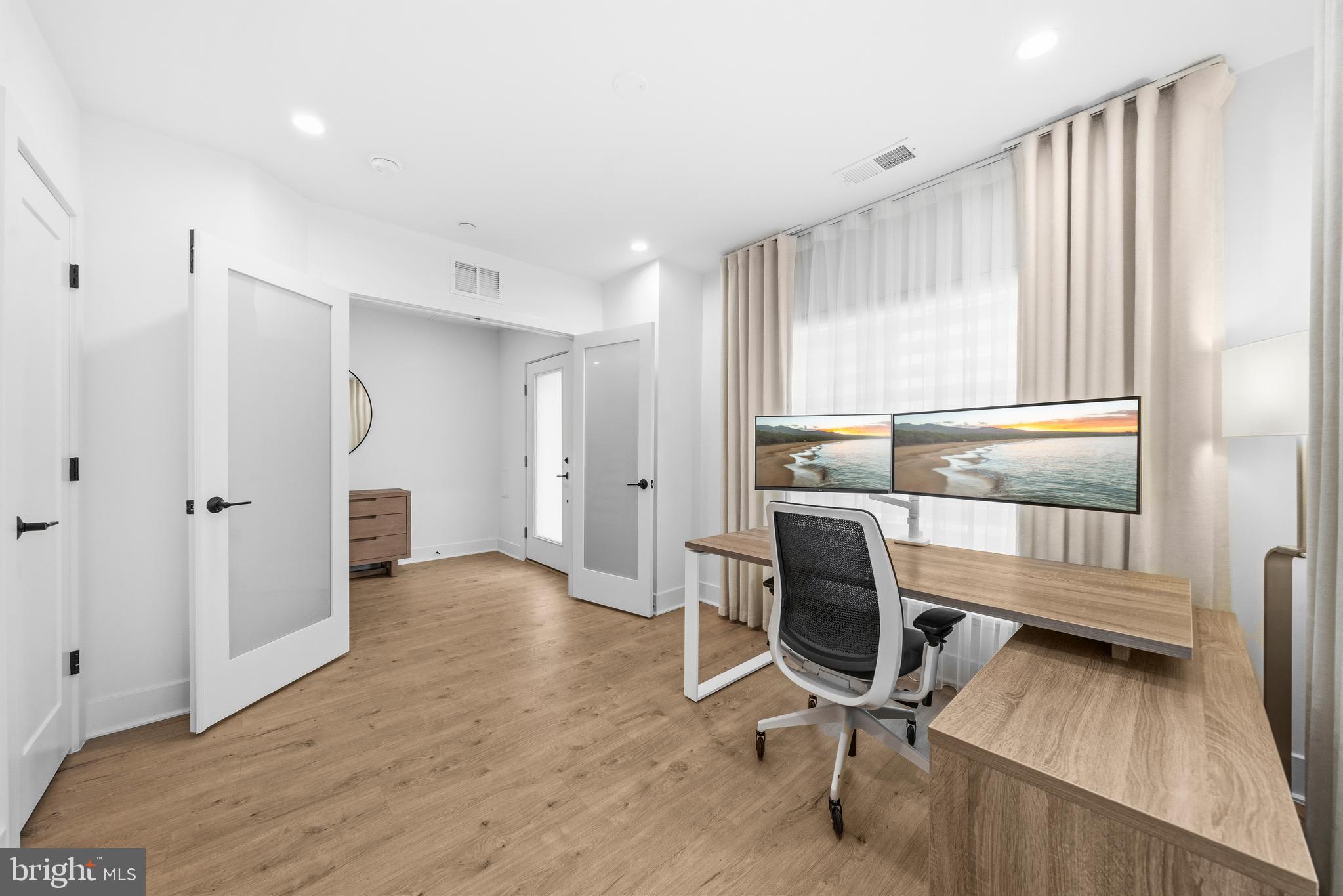 2040 Tysons Ridgeline Road Falls Church, VA 22043 - Photo 42 of 56 a view of a room with wooden floor lounge chair and windows