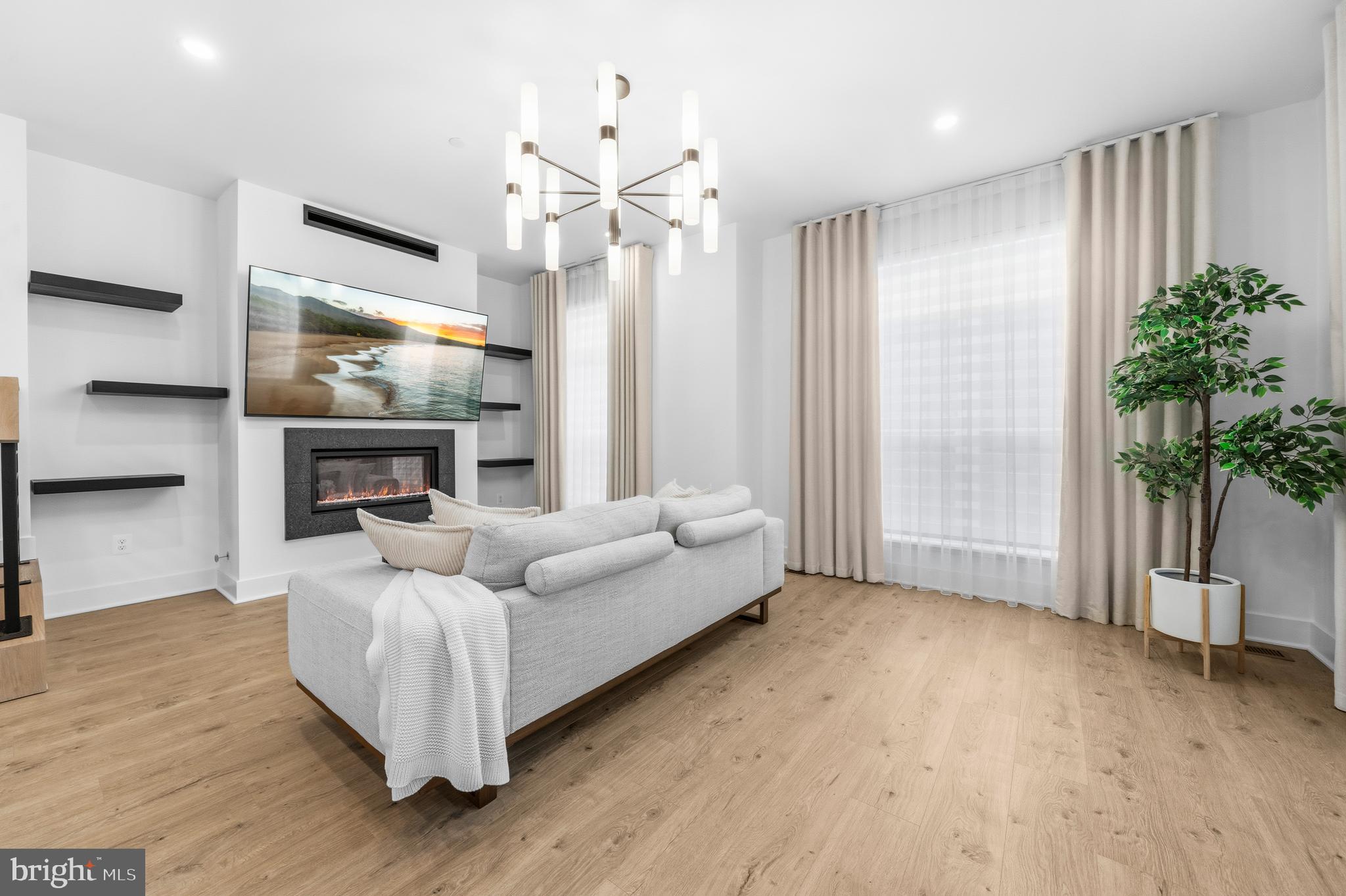 2040 Tysons Ridgeline Road Falls Church, VA 22043 - Photo 5 of 56 a living room with furniture and a fireplace