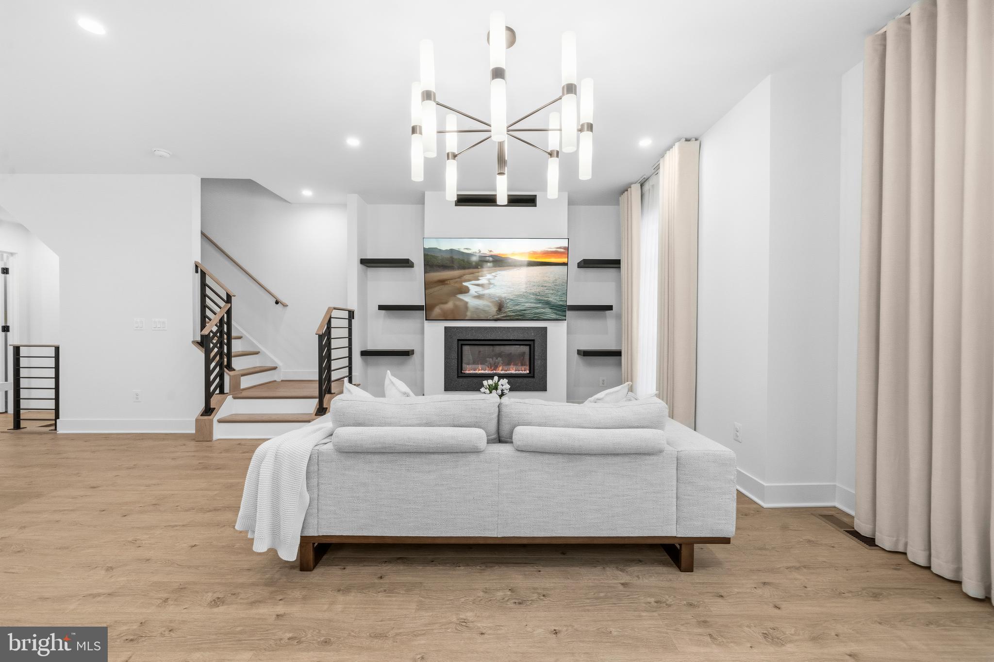 2040 Tysons Ridgeline Road Falls Church, VA 22043 - Photo 6 of 56 a bedroom with a bed and a fireplace