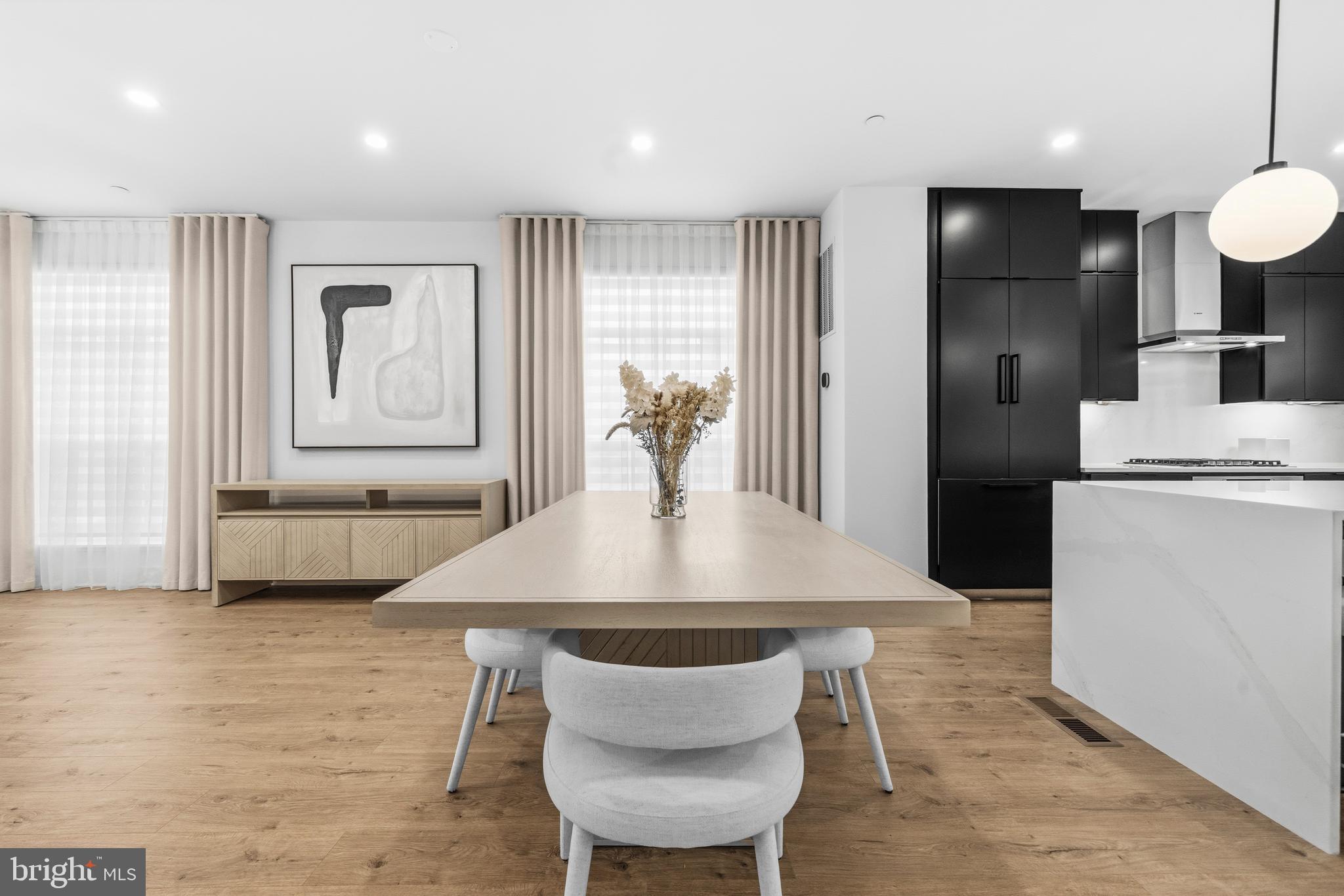 2040 Tysons Ridgeline Road Falls Church, VA 22043 - Photo 10 of 56 a view of a dining room with furniture and wooden floor