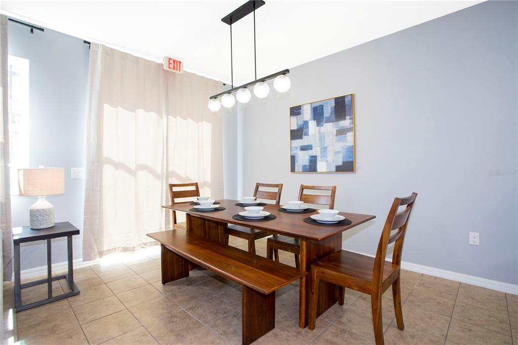 3181 Tocoa Circle Kissimmee, FL 34746 - Photo 21 of 87 a dining room with furniture and window