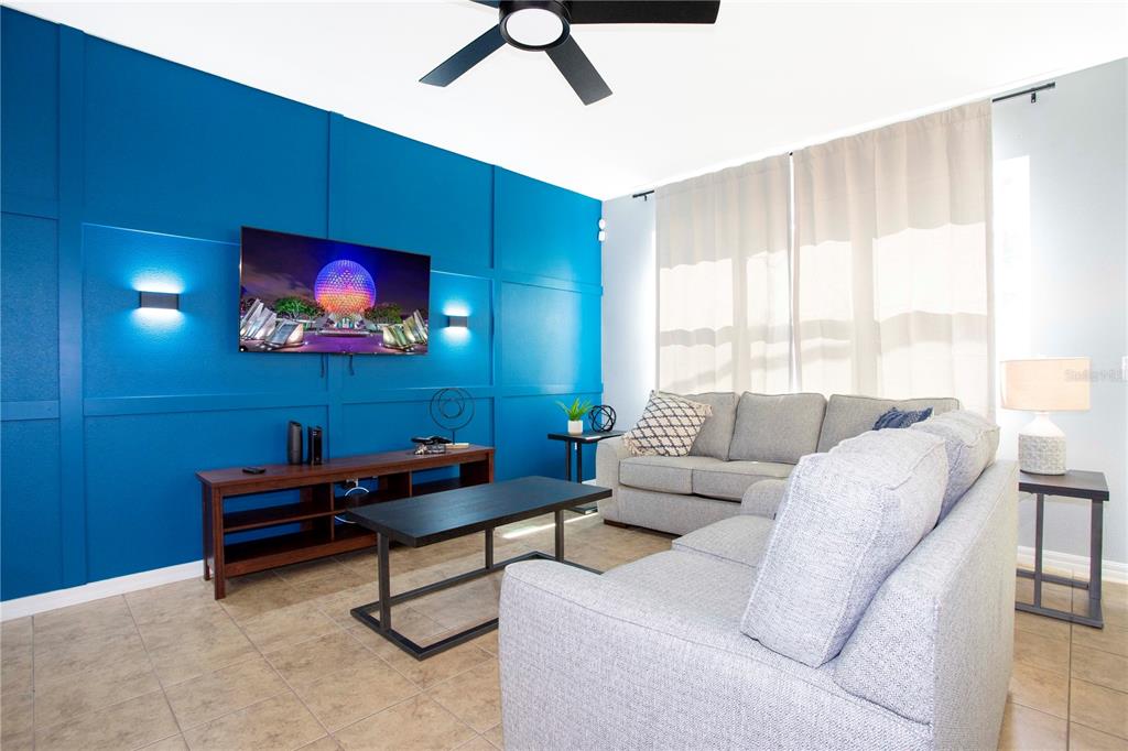 3181 Tocoa Circle Kissimmee, FL 34746 - Photo 22 of 87 a living room with furniture and a flat screen tv