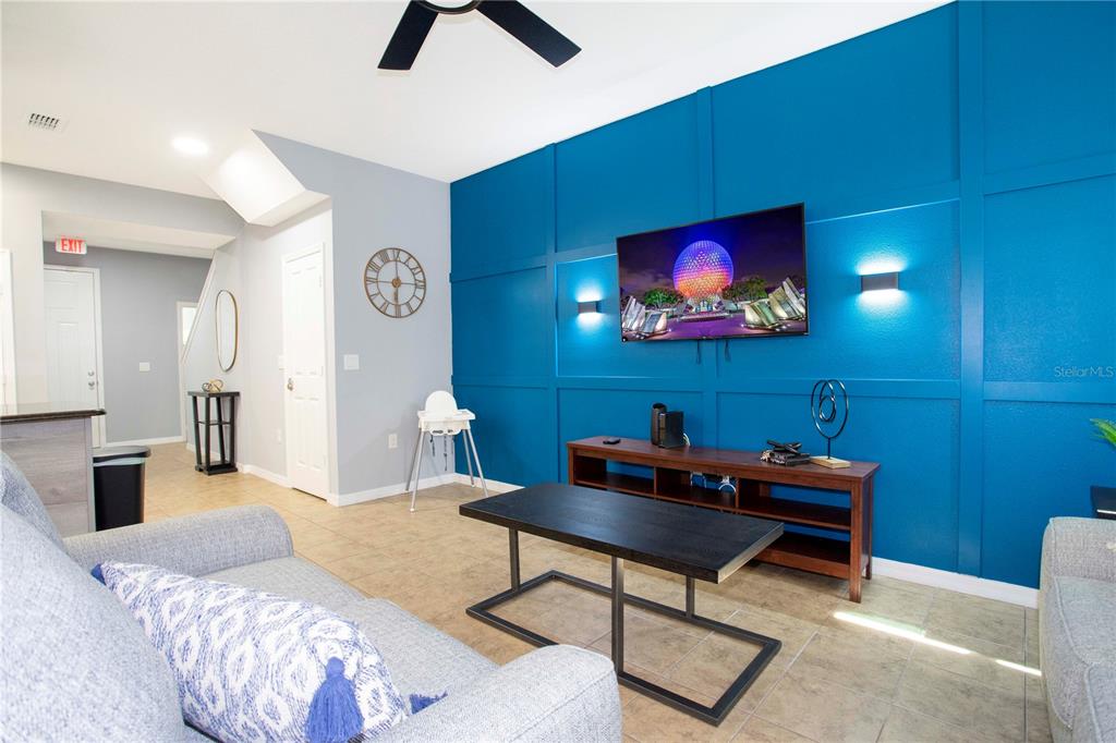 3181 Tocoa Circle Kissimmee, FL 34746 - Photo 29 of 87 a bedroom with furniture and a chandelier