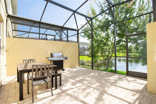 a view of a room with furniture and window