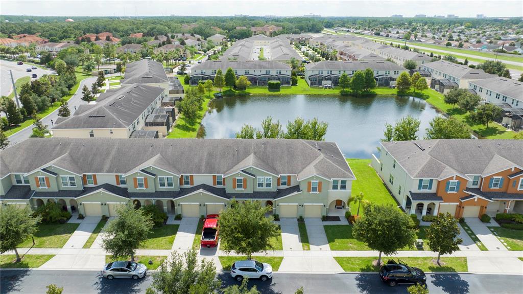3181 Tocoa Circle Kissimmee, FL 34746 - Photo 5 of 87 an aerial view of a house with a garden and lake view